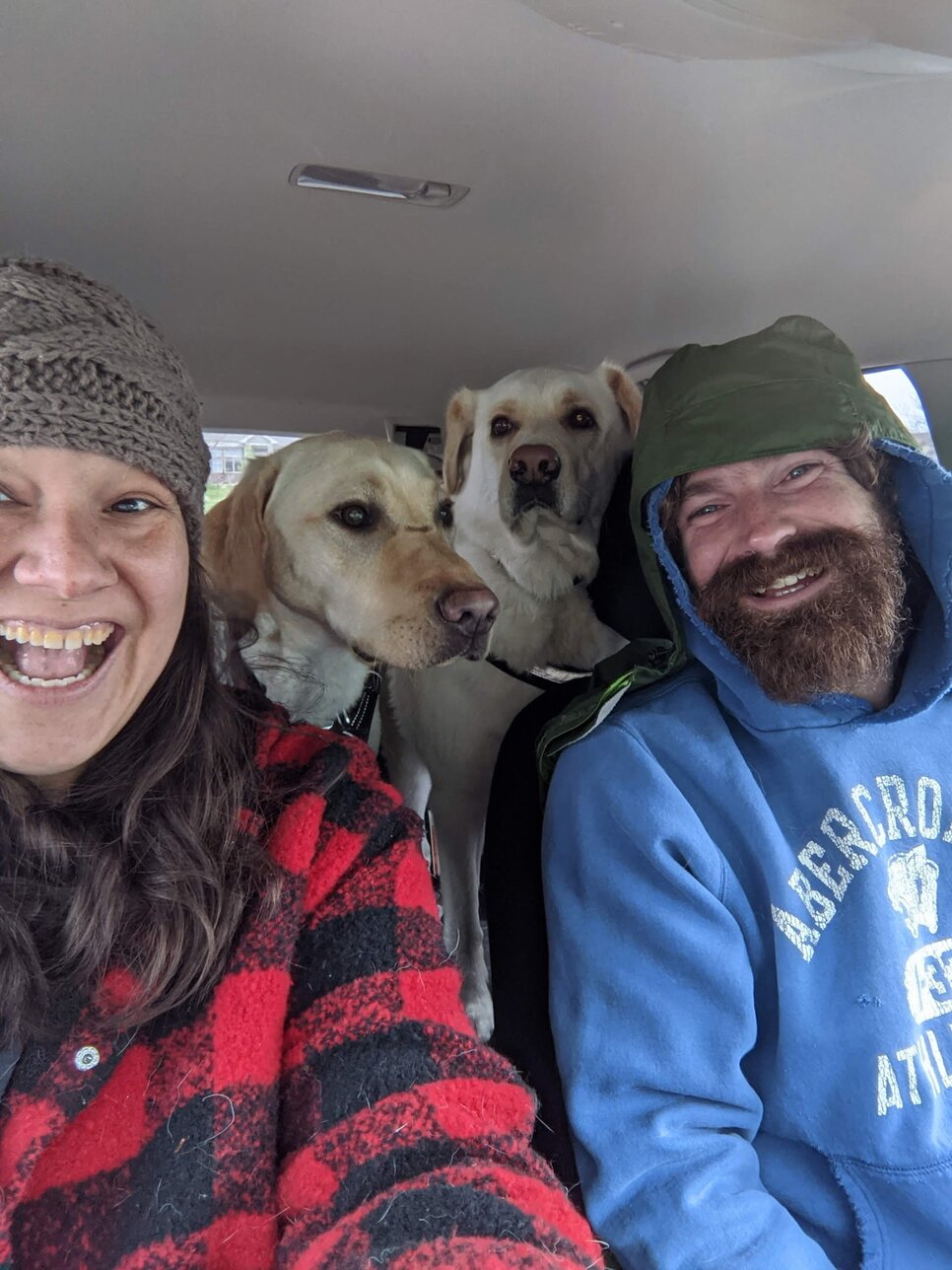 Maureen Maycheco with her family and dogs in the car