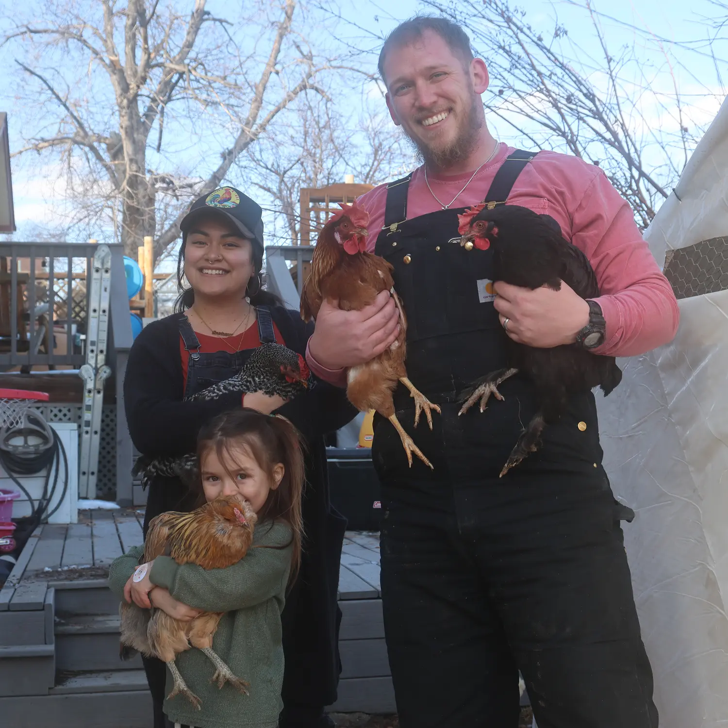 From left to right: Janelle, Casey and Luke McCarthy hold their chickens Stickers, Penguin, Bunny and Rowena. Photo: Kyle Cooke, Rocky Mountain PBS