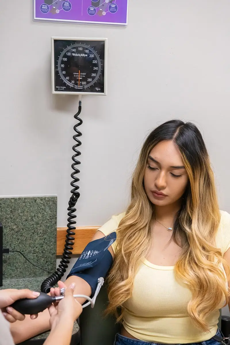 A medical assistant checks Ingrid’s vital signs in an exam room at Monfort Family Clinic on Wednesday, June 18, 2025, in Evans, Colorado. Photo: Tanya Fabian, special to The Colorado Trust