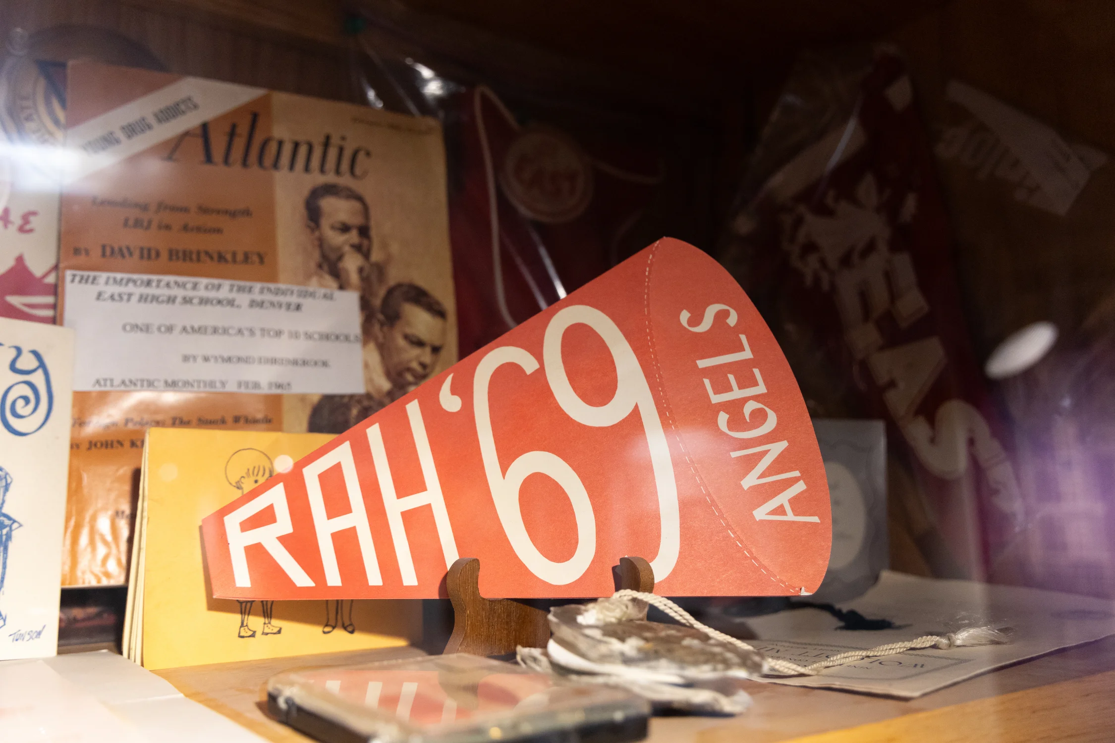 The cases in the museum are organized by decade, featuring diplomas, theater programs, magazines and school spirit memorabilia. Photo: Carly Rose, Rocky Mountain PBS.