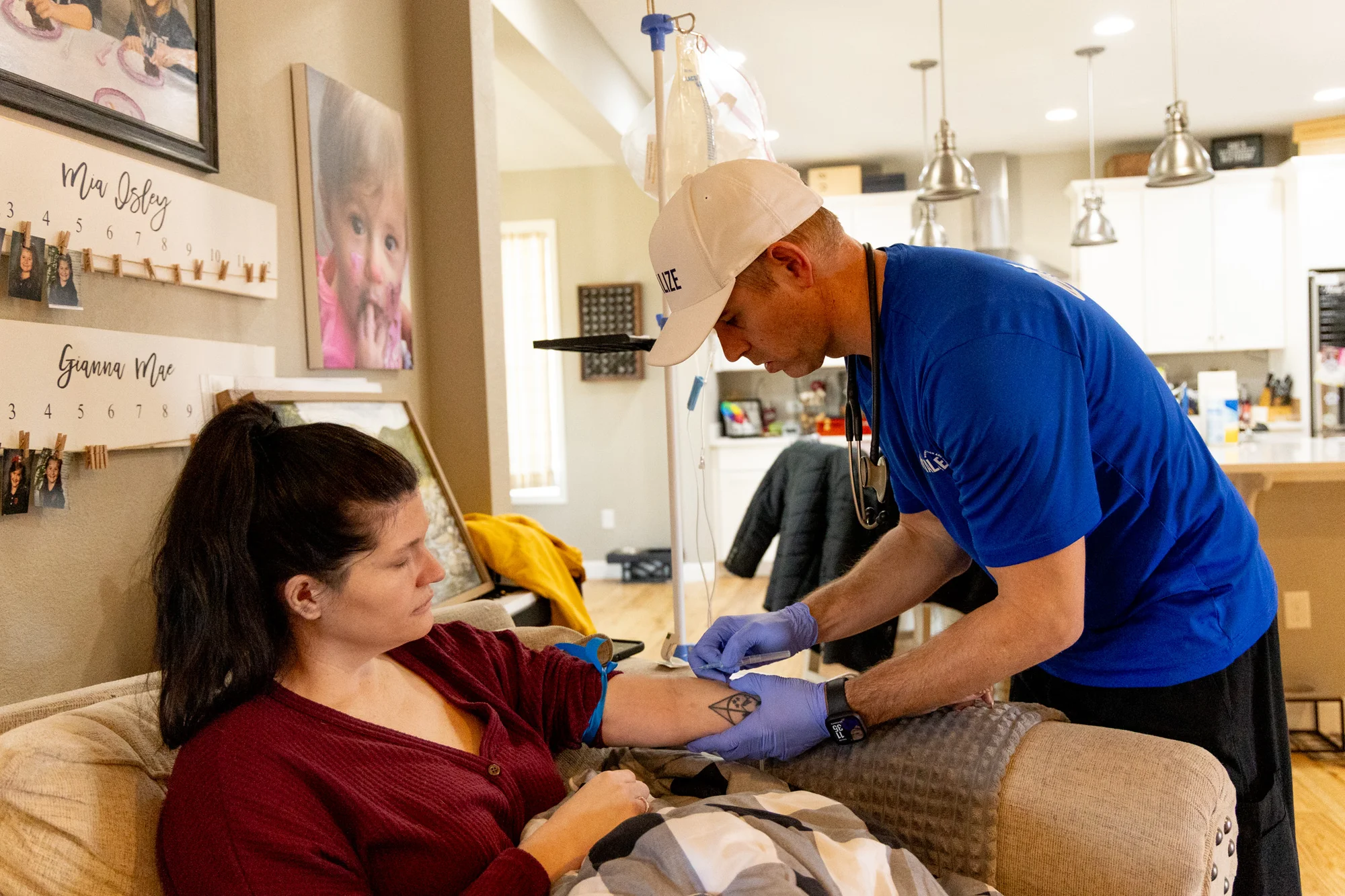 Matthew Lane administers IV therapy on Kerianne Cussio, who is diagnosed with gastroparesis. Photo: Priya Shahi, Rocky Mountain PBS