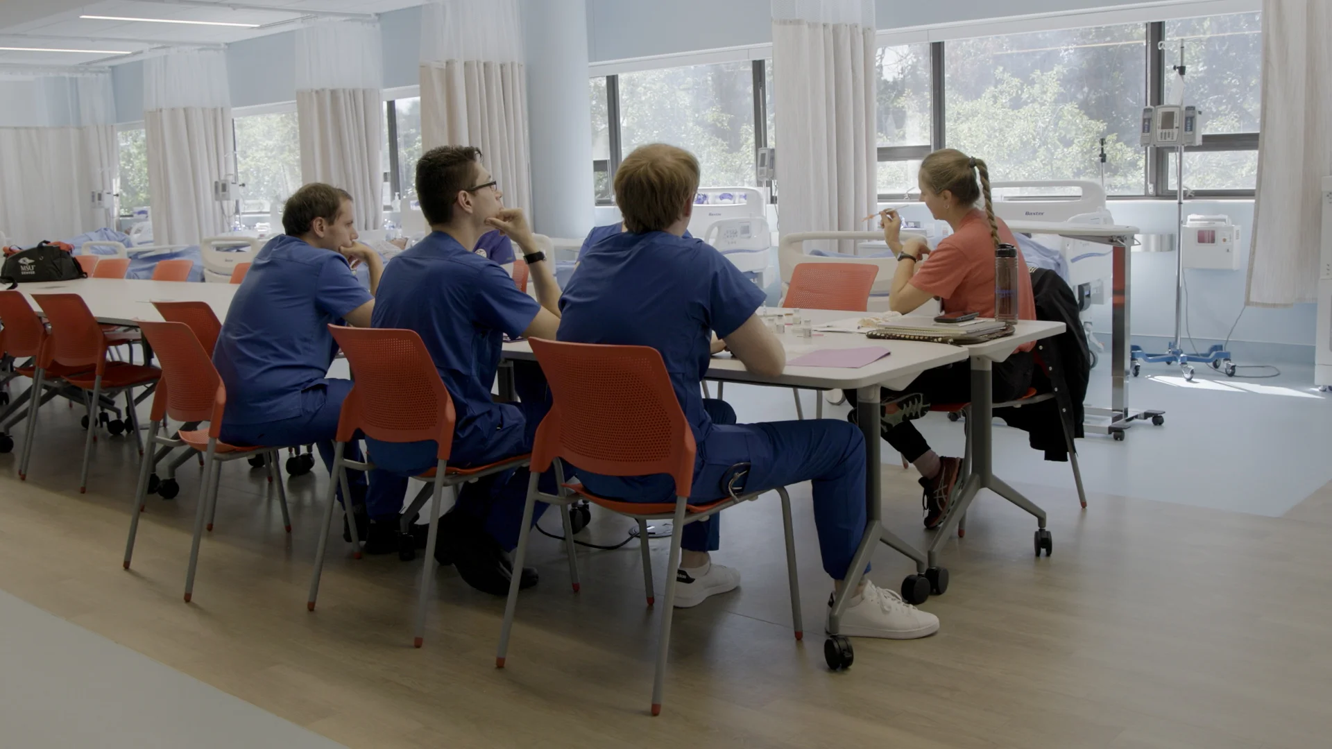 Nursing students practice giving shots with their teacher in one of the facility’s two new lab-classrooms. Photo:  Andrea Kramar, Rocky Mountain PBS