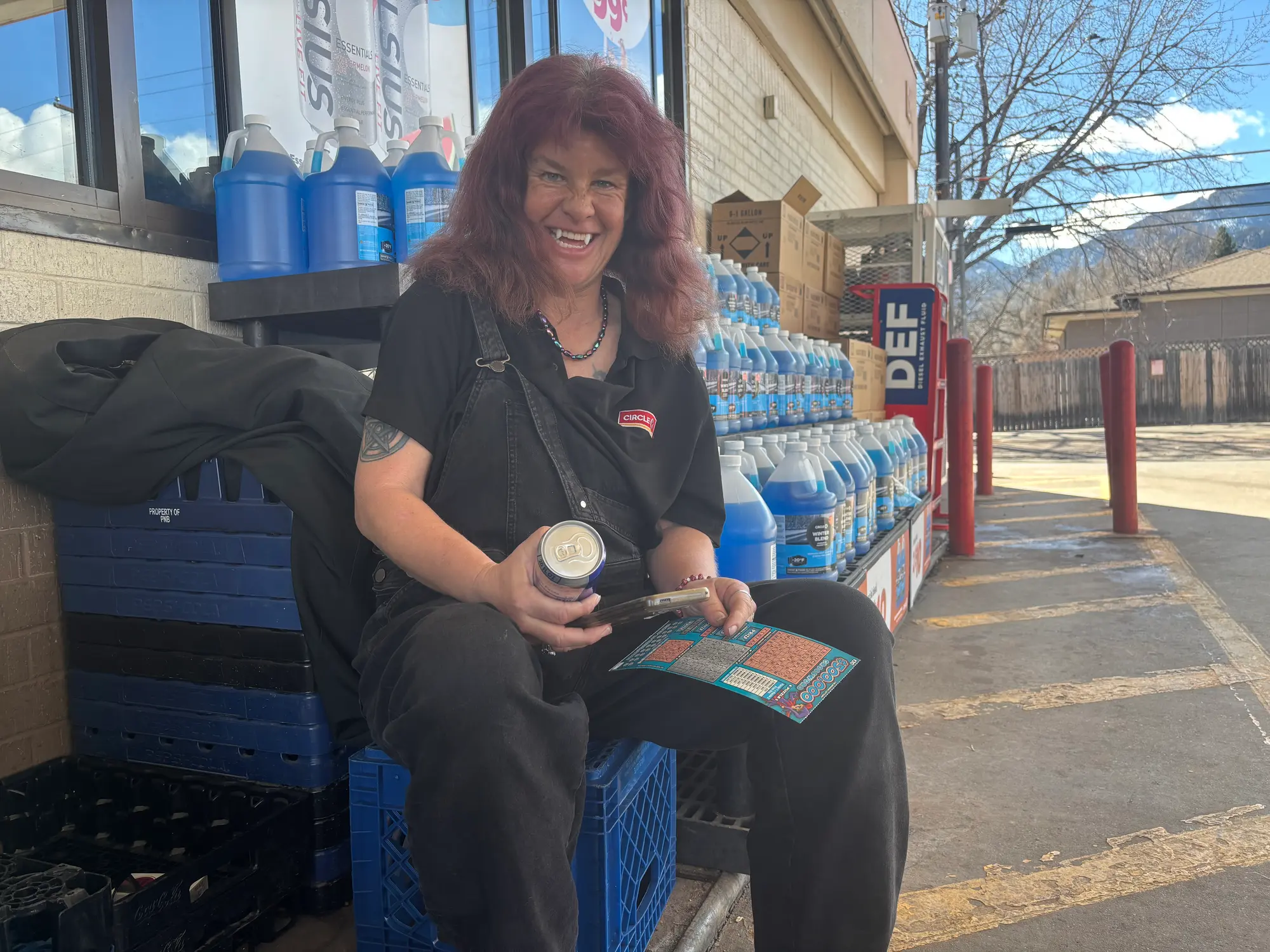 Amy Goldsbury prepares for her shift at Circle K with a Redbull and lottery ticket. Photo: Alec Berg, Rocky Mountain PBS
