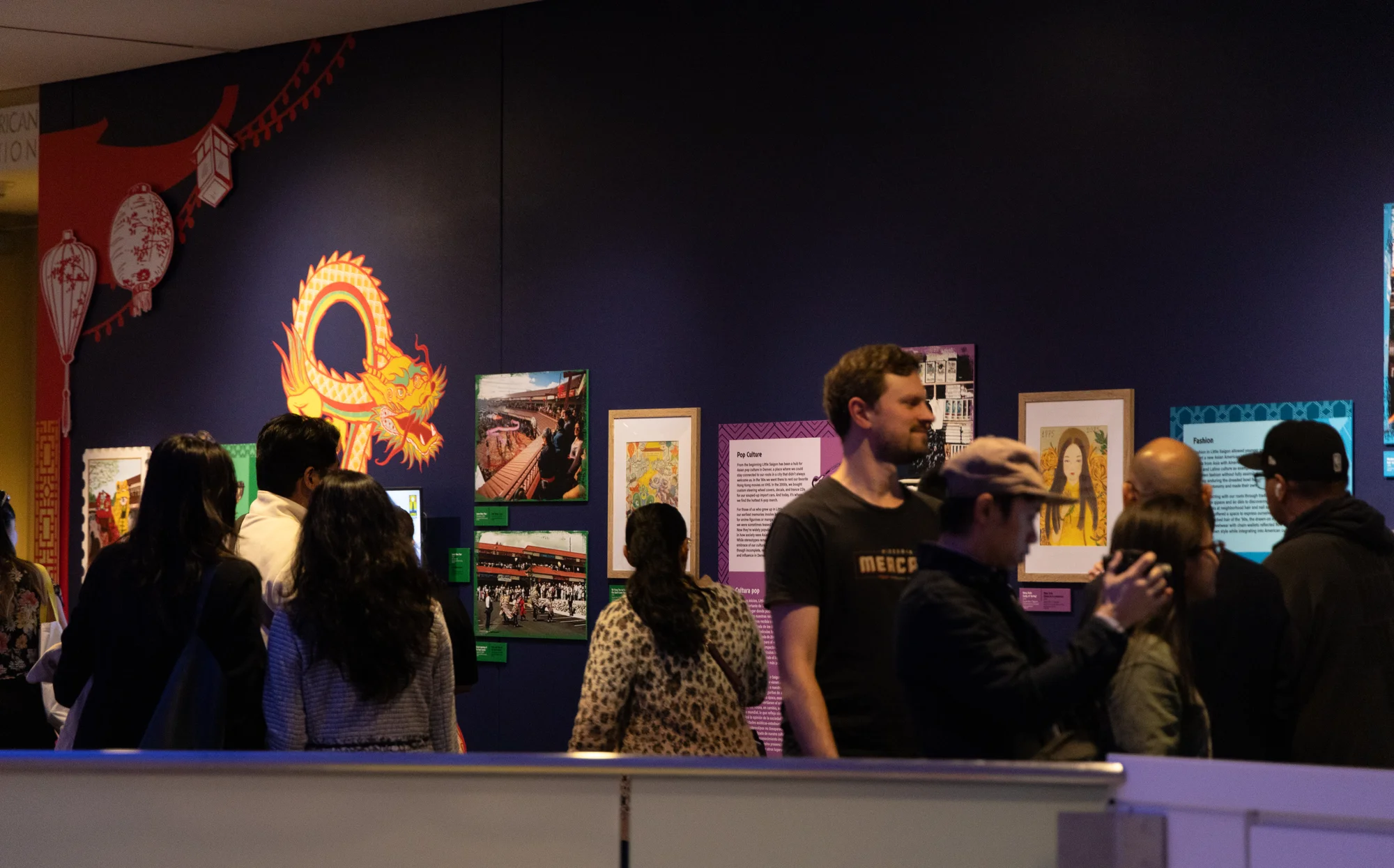 Hundreds of people showed up for the opening night of the exhibition. The opening night included traditional milk tea and foods, and a performance of life-sized costumed puppets known as lion dancers in Asian culture.  Photo: Andrea Kramar, Rocky Mountain PBS