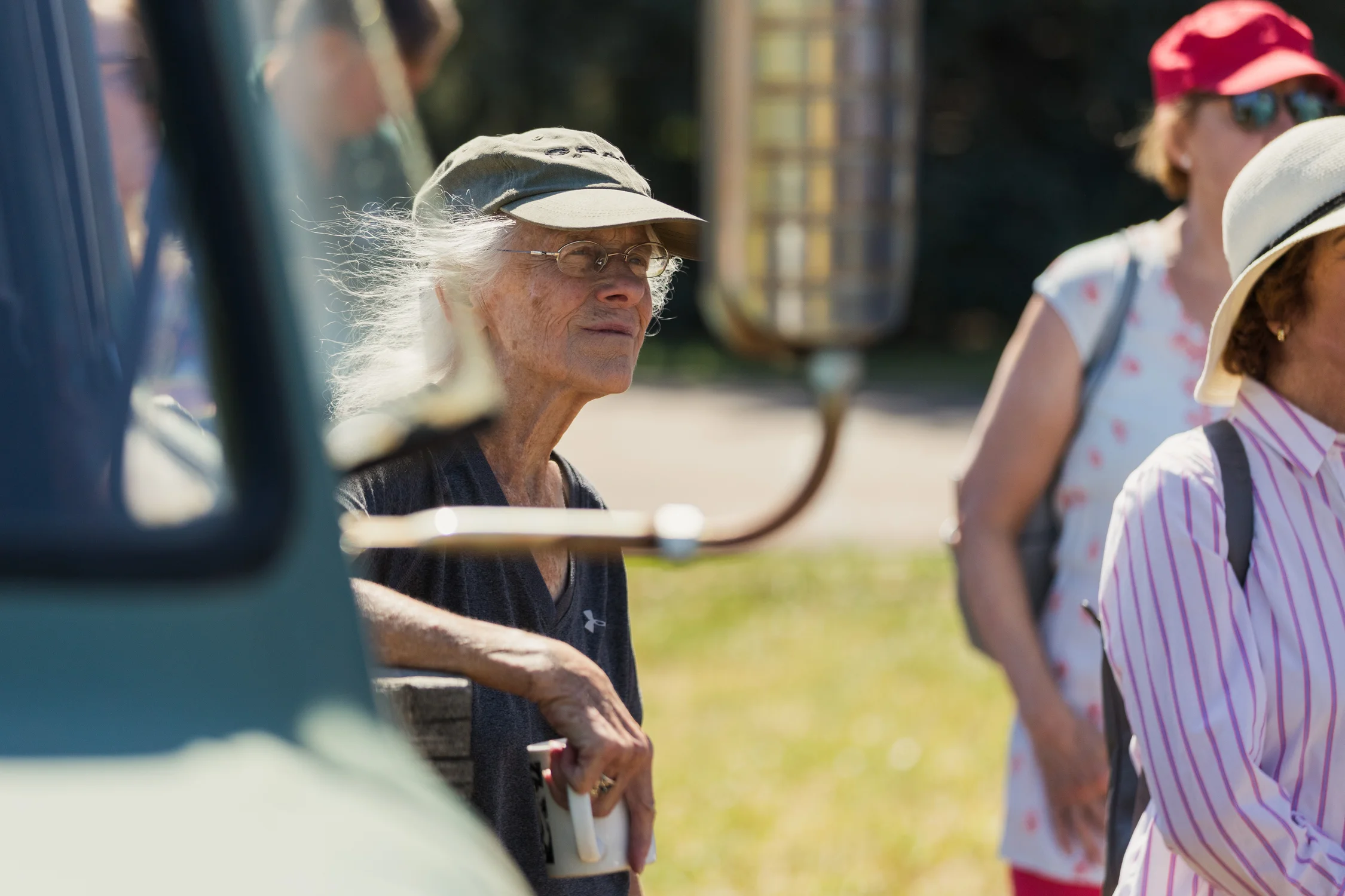 Susan Wilson of Niwot listens at a rally against minimum wage increases in Boulder County. Wilson has lived in Niwot since 1981. She worries wage increases will force more restaurants to close. Niwot’s 1914 closed in 2024. Farrow and Lefty’s Pizza closed in 2025. Photo: Cormac McCrimmon, Rocky Mountain PBS