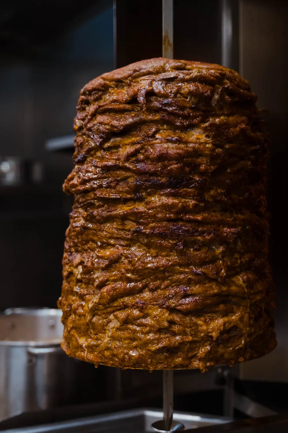Al pastor, a classic marinated Mexican pork dish, cooks on a vertical spit called "trompo." Photo: Peter Vo, Rocky Mountain PBS