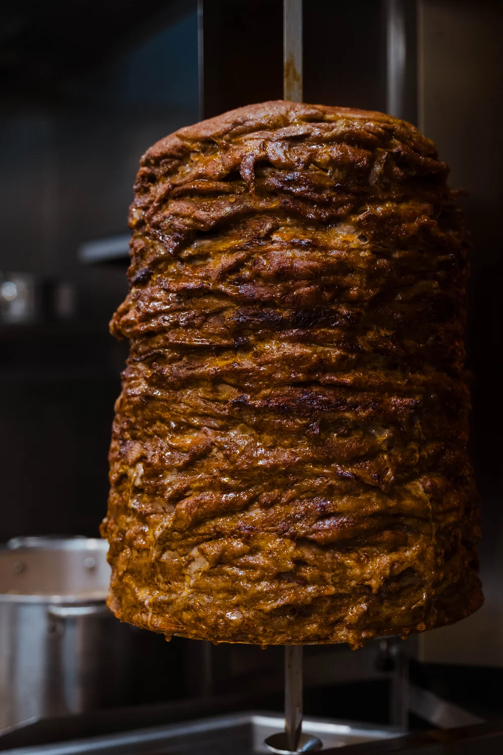 Al pastor, a classic marinated Mexican pork dish, cooks on a vertical spit called "trompo." Photo: Peter Vo, Rocky Mountain PBS