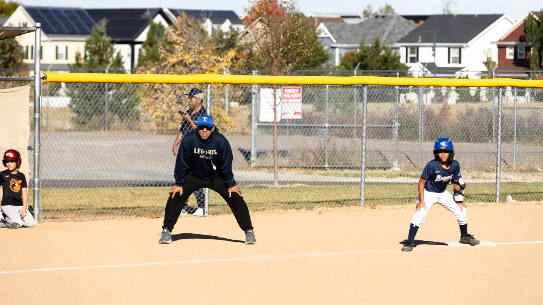Edgar Ramos and one of his players looks on with anticipation for the next play. Photo: Amanda Horvath, Rocky Mountain PBS