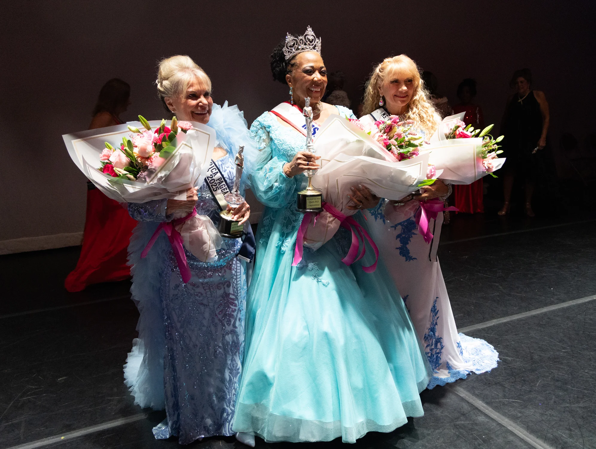 First runner-up Charlie Myers, Ms. Colorado Senior America 2025 Terrilynn Moore-Smith and second runner-up Arya Farwell pose for a photo after the pageant. Photo: Carly Rose, Rocky Mountain PBS