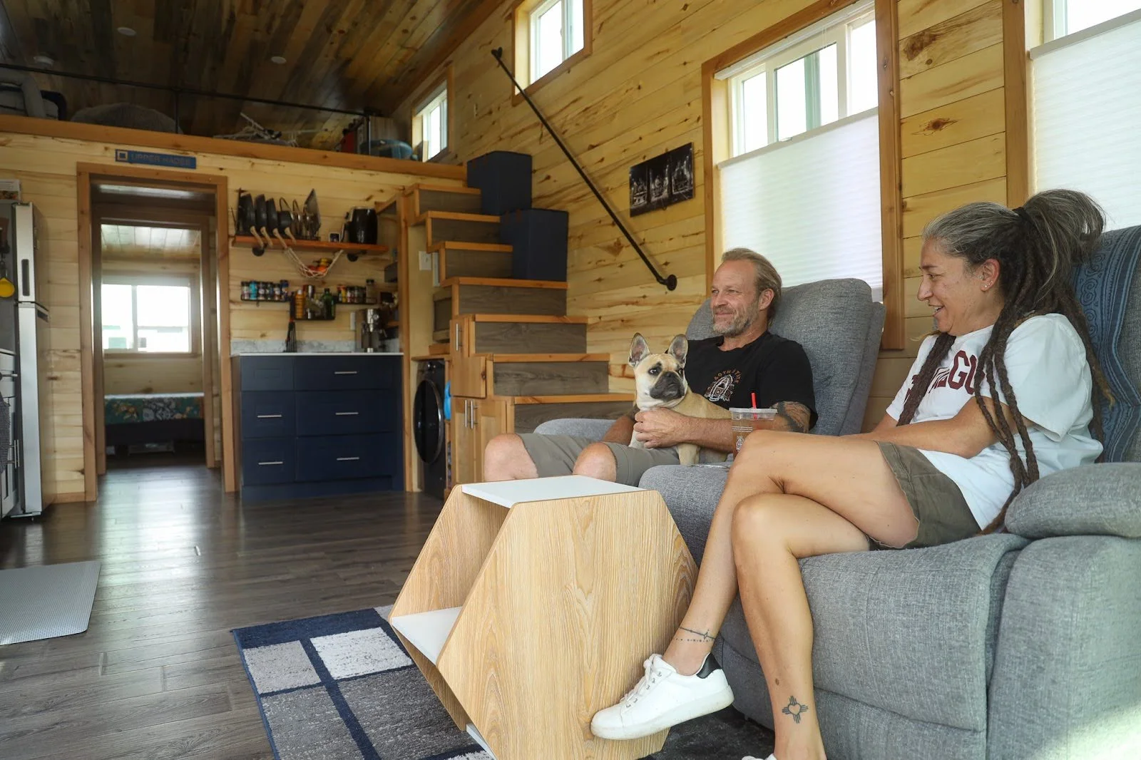 Tedd and Denise Rohwer on the couch with their dog. Photo: Ziyi Xu, Rocky Mountain PBS