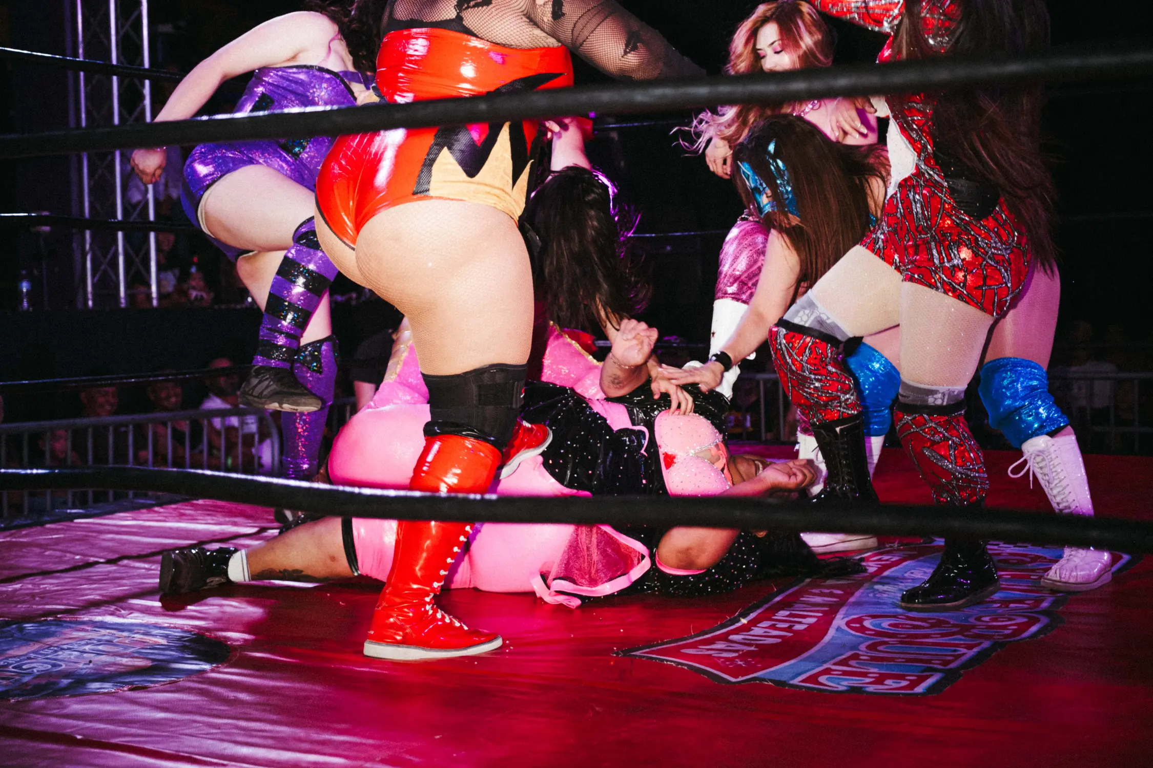 Luchadoras teaming up against Big Mami. Photo: Peter Vo, Rocky Mountain PBS