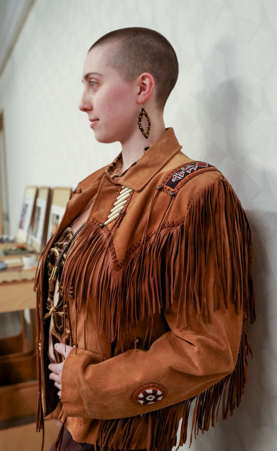 Indigenous peoples used fringe to decorate their garments and keep hems from becoming unraveled.  Modeled by Kelly Larson. Photo: Carly Rose, Rocky Mountain PBS