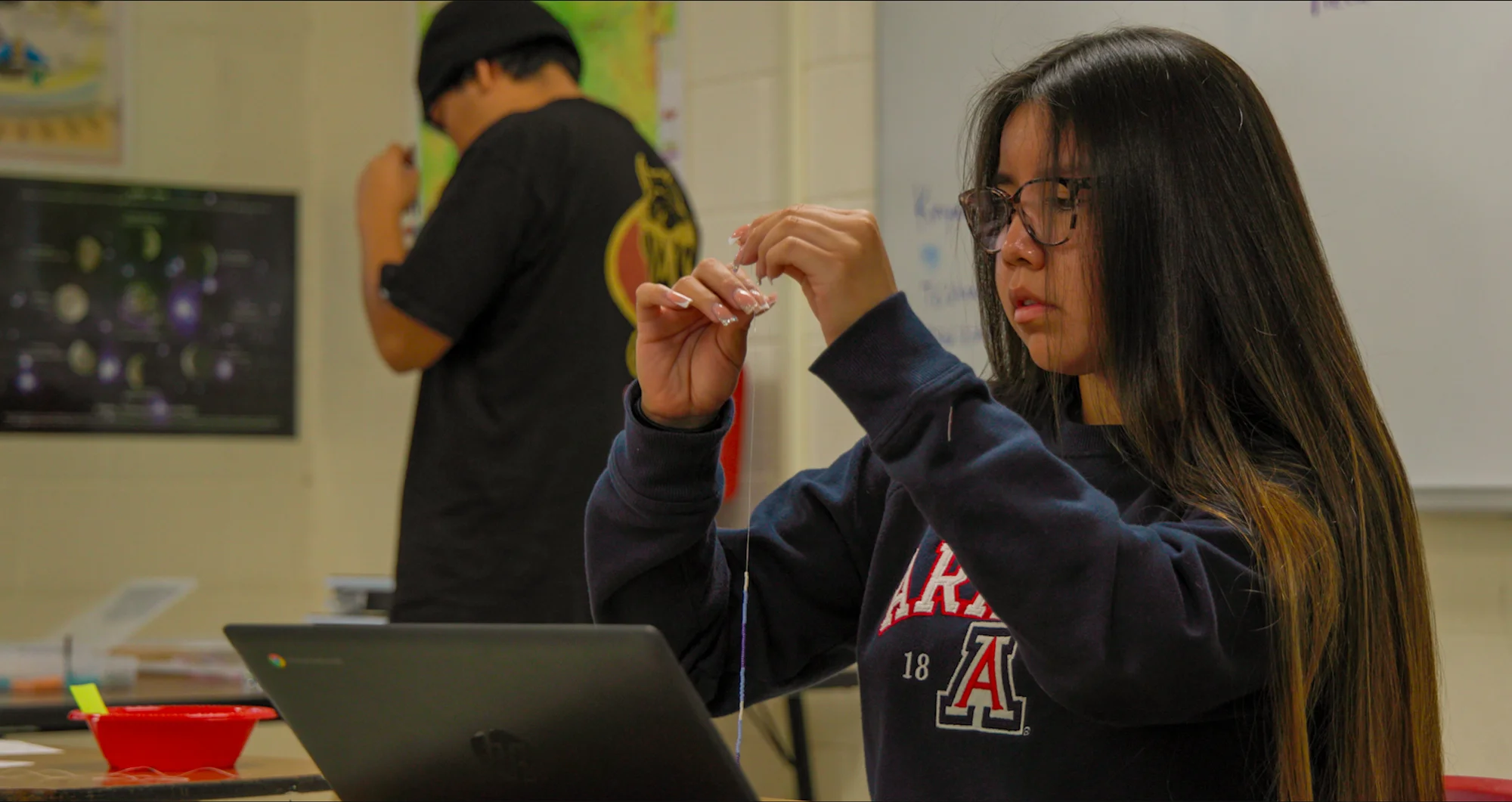 Kaleigh Kailer Atizbáá, a Level 2 student, works on creating a necklace. Photo: Ziyi Xu, Rocky Mountain PBS