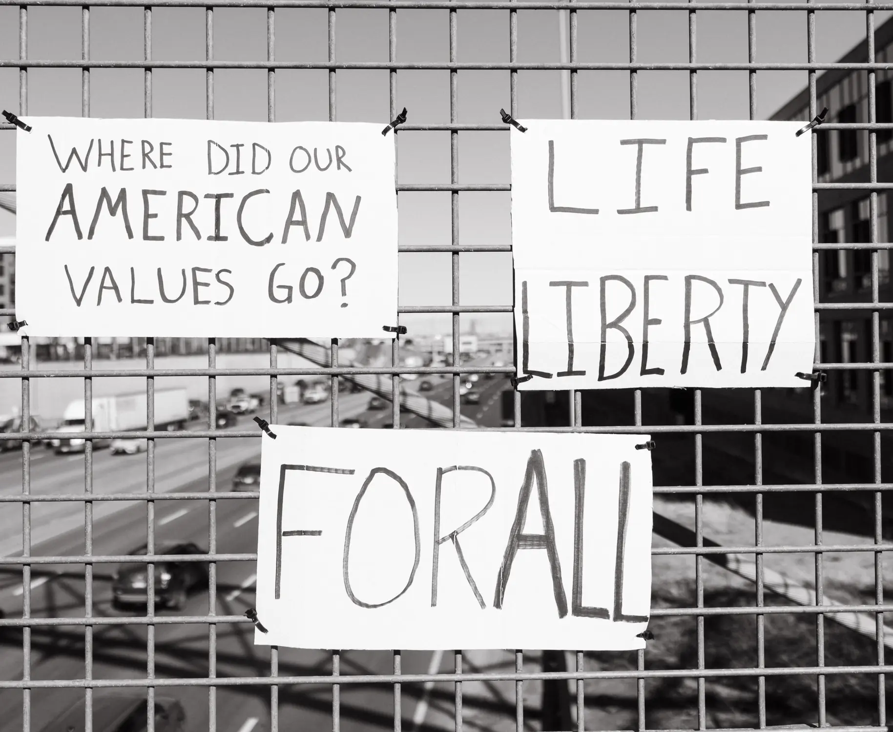 Signs displayed on the bridge. Photo: Peter Vo, Rocky Mountain PBS