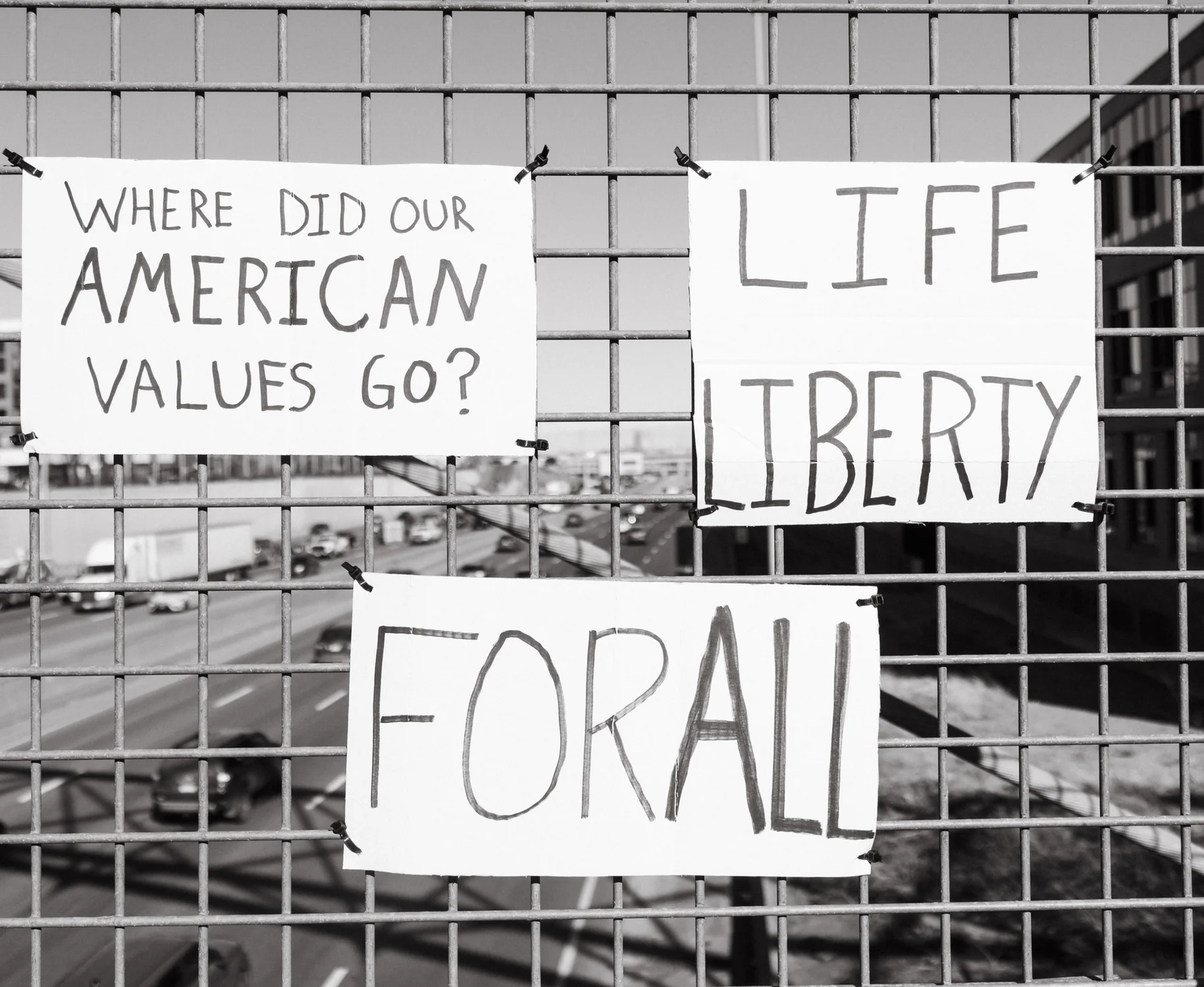 Signs displayed on the bridge. Photo: Peter Vo, Rocky Mountain PBS