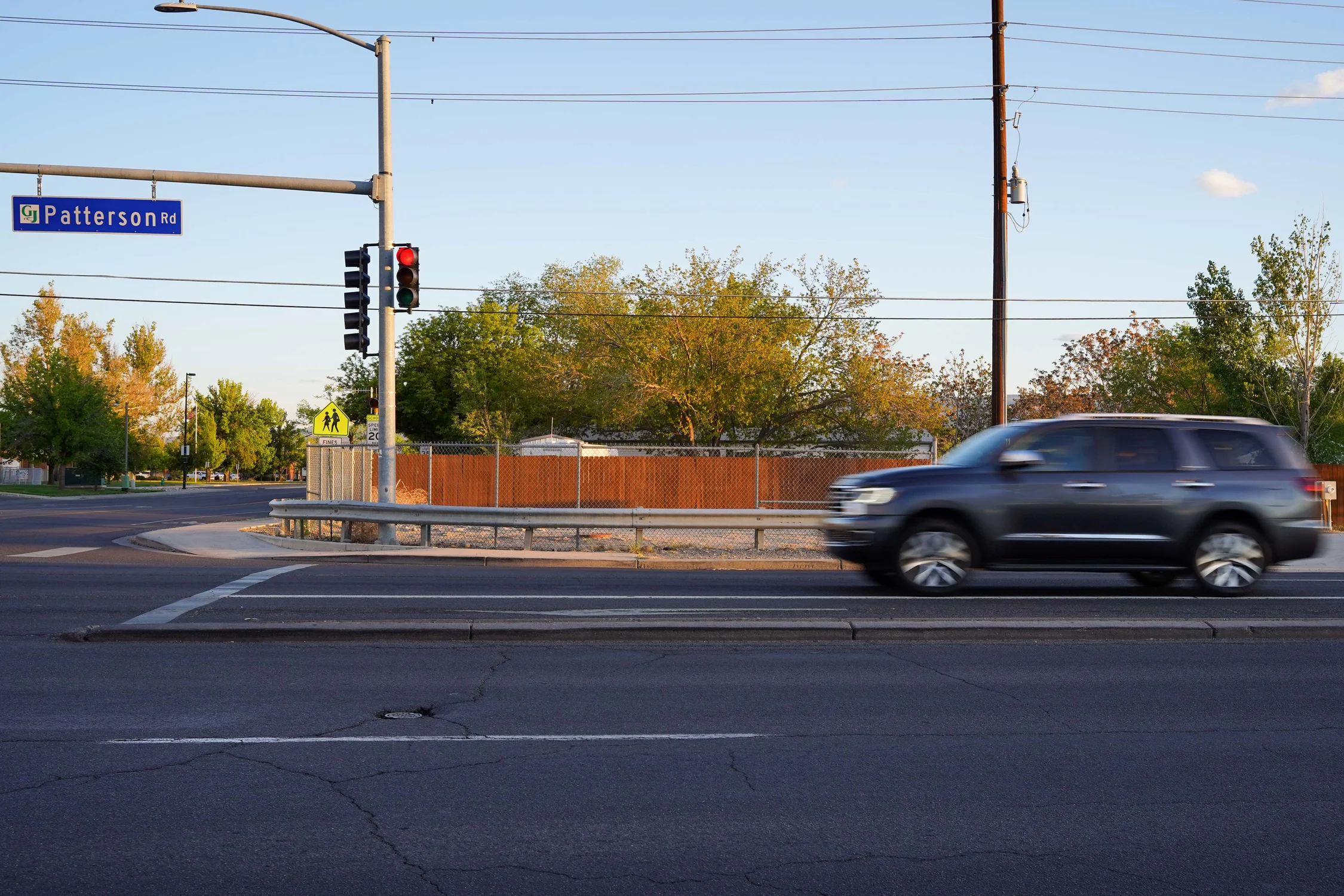 A car passes in front of the only few feet of sidewalk on the south side of Patterson Road near 25 ½ Road. Photo: Joshua Vorse, Rocky Mountain PBS