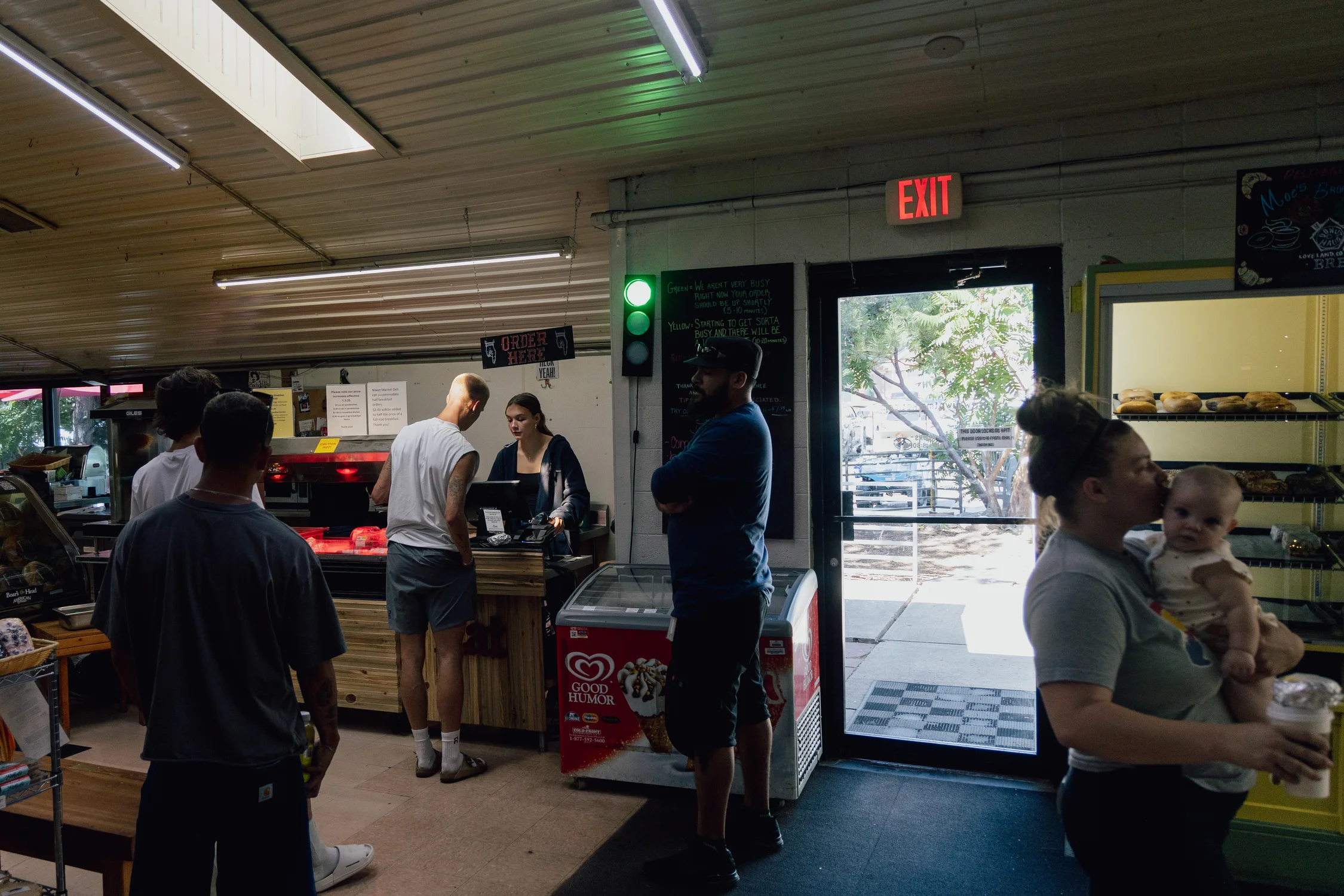 Customers order food at the Niwot Market. Niwot Market owner Alison Steele is concerned about the impact minimum wage increases will have on her business and others in the community. Photo: Cormac McCrimmon, Rocky Mountain PBS