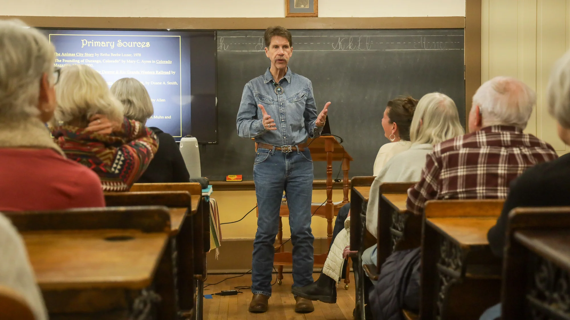 Robert McDaniel giving a presentation at the Animas Museum. Photo: Ziyi Xu, Rocky Mountain PBS
