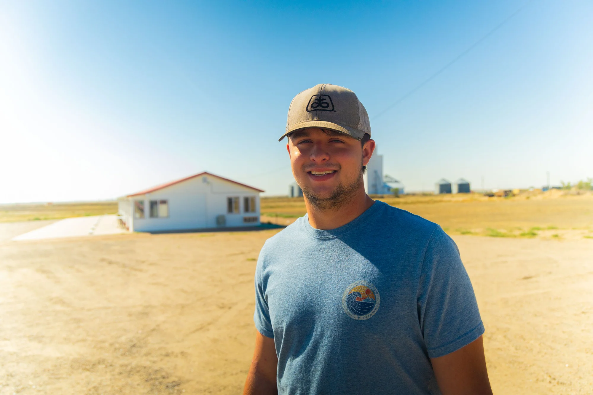 Paul, 20, stands next to the Bin Inn Motel, which he acquired as a high school senior. Photo: Chase McCleary, Rocky Mountain PBS