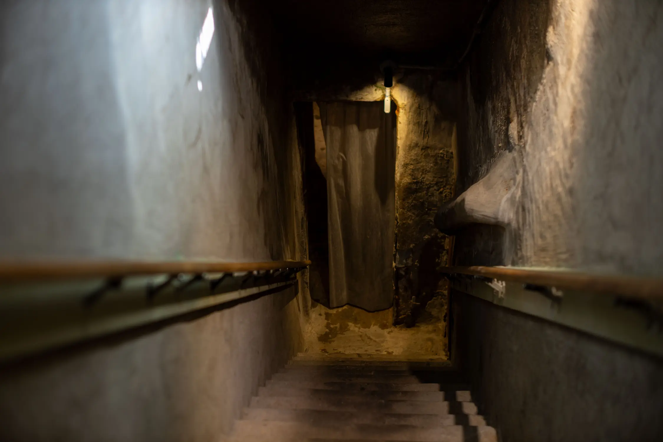 The steps leading down to the 110 degree cave. Visitors are greeted by a sign asking them to respect the quiet of the caves and speak in low tones. Photo: Alexis Kikoen, Rocky Mountain PBS