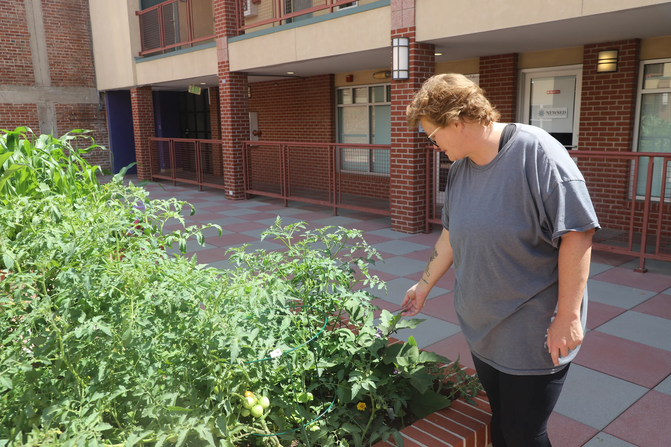 Hawk stands in her garden. Photo: Alec Berg, Rocky Mountain PBS