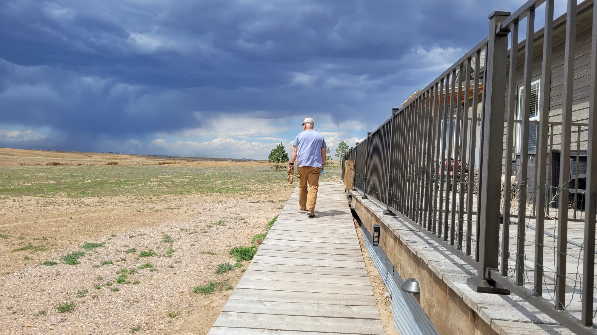 Randy Wheeler and his wife, Kimber, built their house on undeveloped prairie in 2021. The land is privately owned but sits within the boundary of the Pawnee National Grassland. Since developing their lot, the Wheelers have since adopted a conservationist attitude for prairie. Photo: Rae Solomon, KUNC