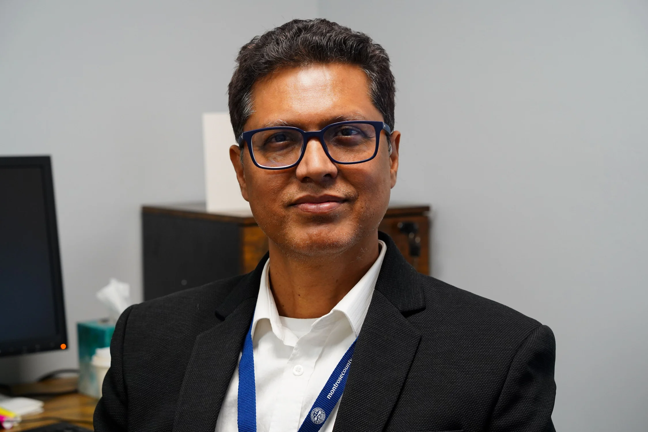 Mirza Ahmed poses for a photo in his office at Montrose County Public Health. He started as director of the department last month. Photo: Joshua Vorse, Rocky Mountain PBS