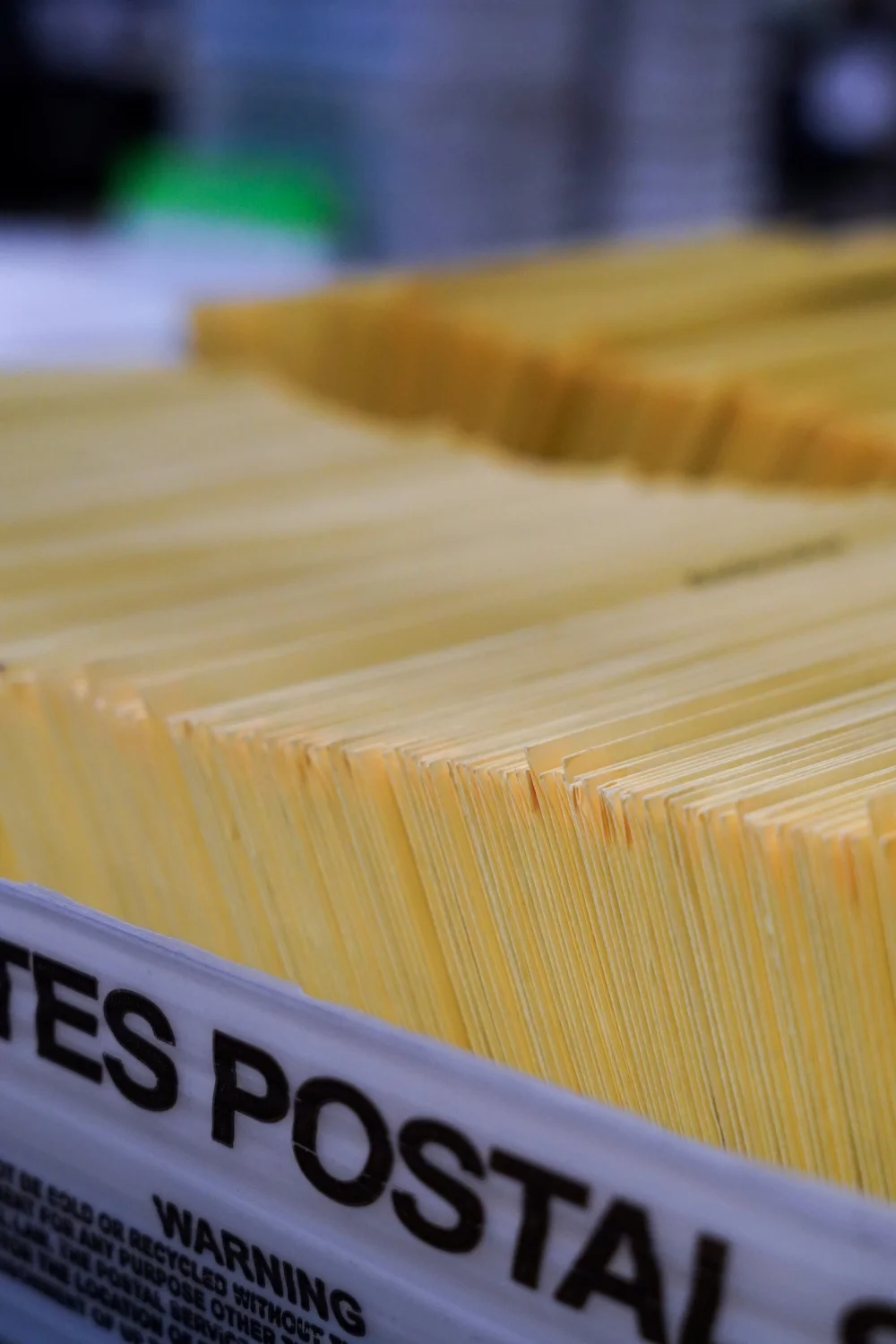 Ballots sit in a post office bin between stations in the Mesa County elections office. Photo: Joshua Vorse, Rocky Mountain PBS