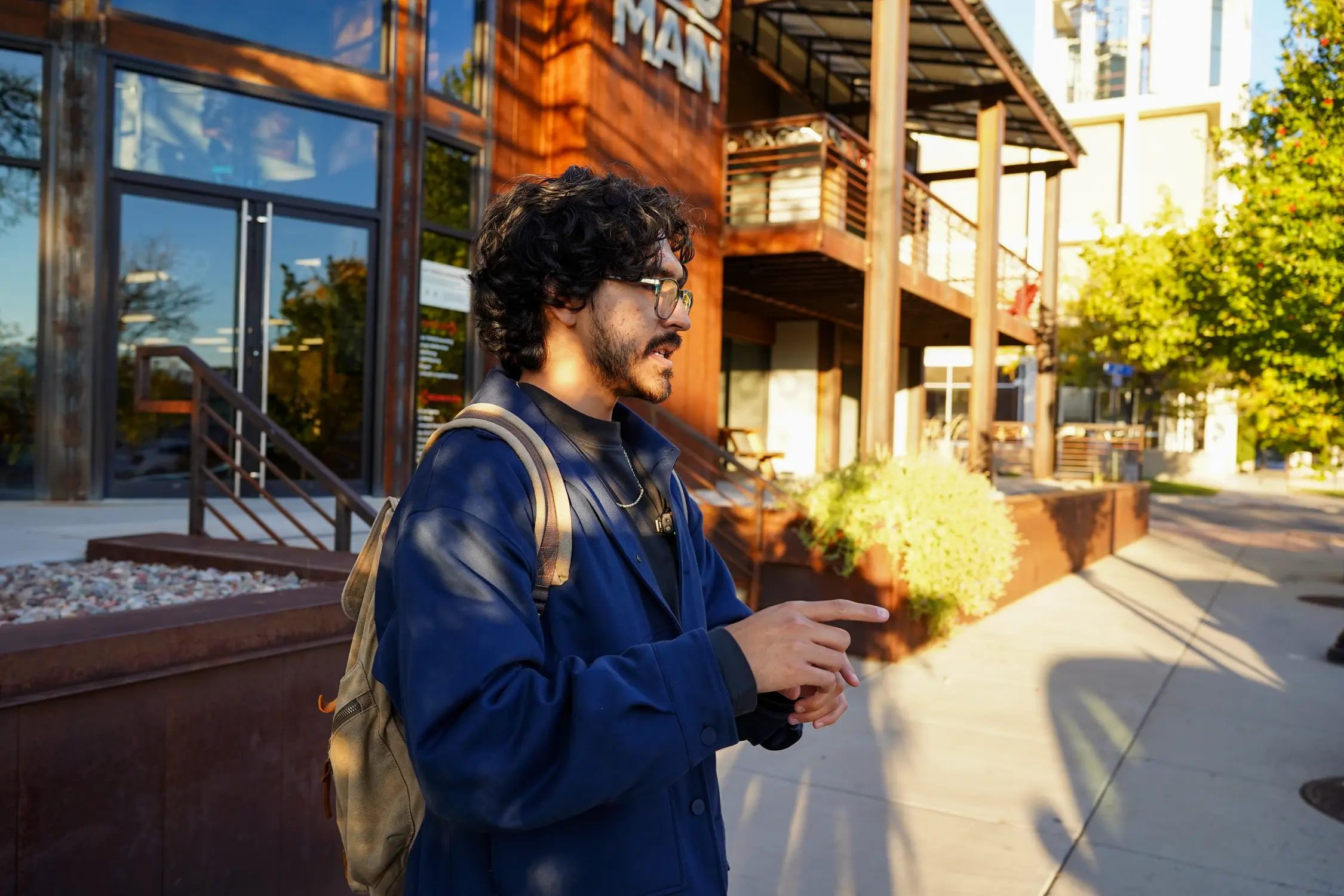 Gallegos stands in front of one of the filming locations for “Interlude,” his crew set up a camera in the median across from the building to get a particular shot. Photo: Joshua Vorse, Rocky Mountain PBS