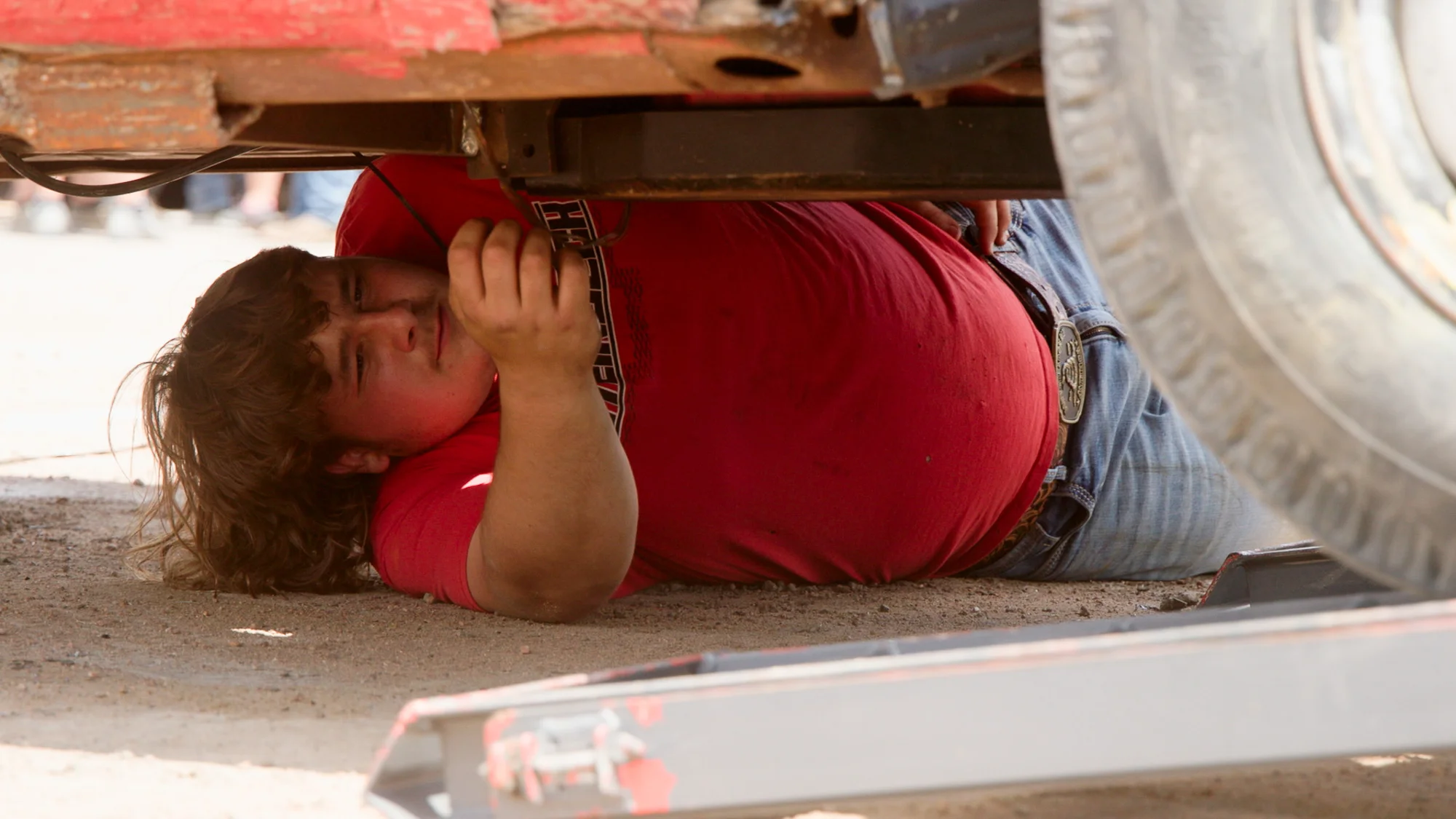 A contestant works on his car in the pit before the show. Photo: Cormac McCrimmon, Rocky Mountain PBS