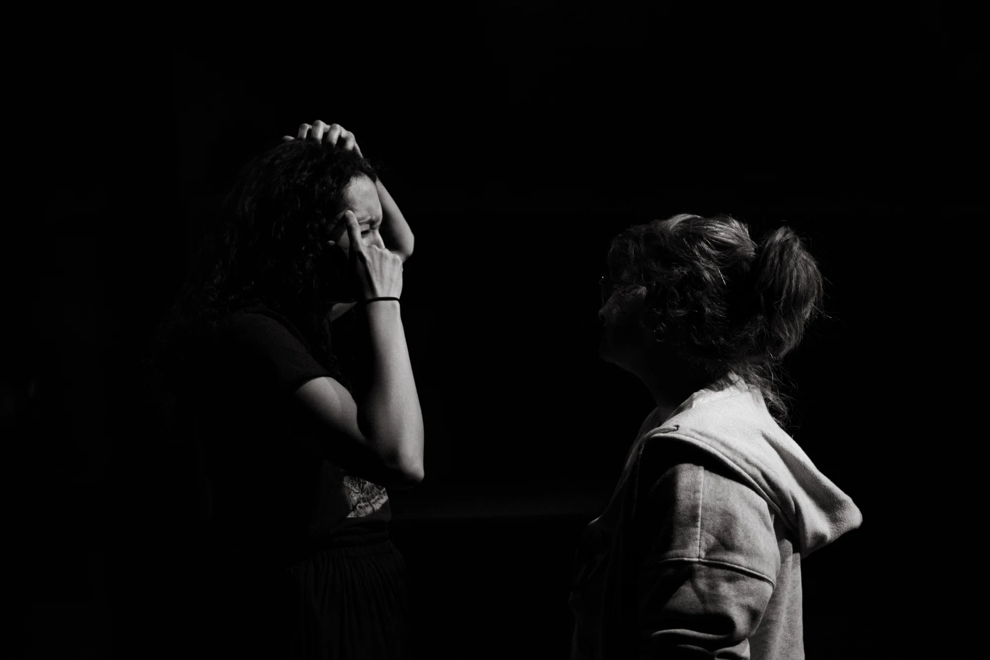 Olivia Buntaine (right) talks with Tamarra Nelson (left) about cues.