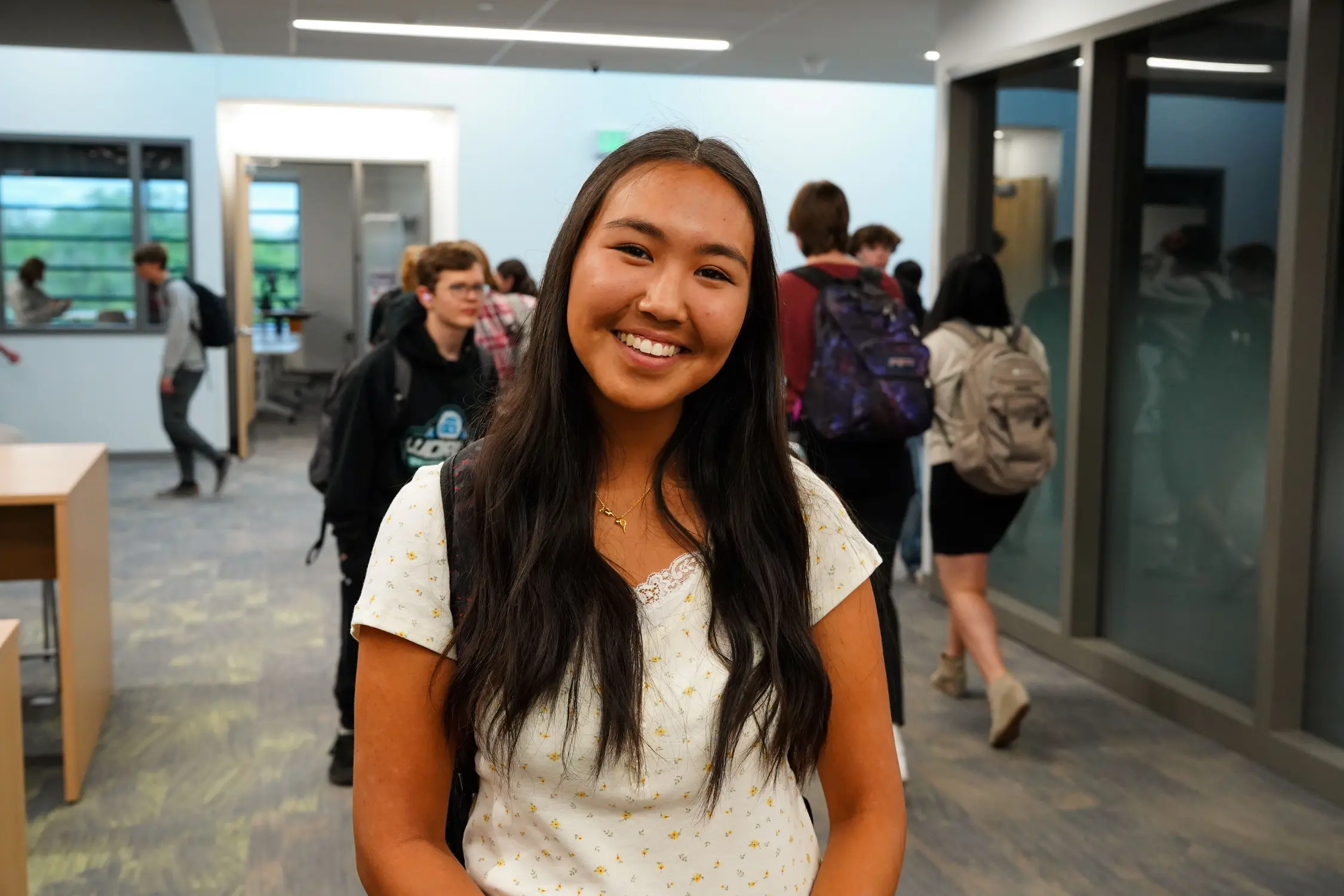 Anara Munkhtogoo poses for a photo in a busy hallway at GJHS. Photo: Joshua Vorse, Rocky Mountain PBS