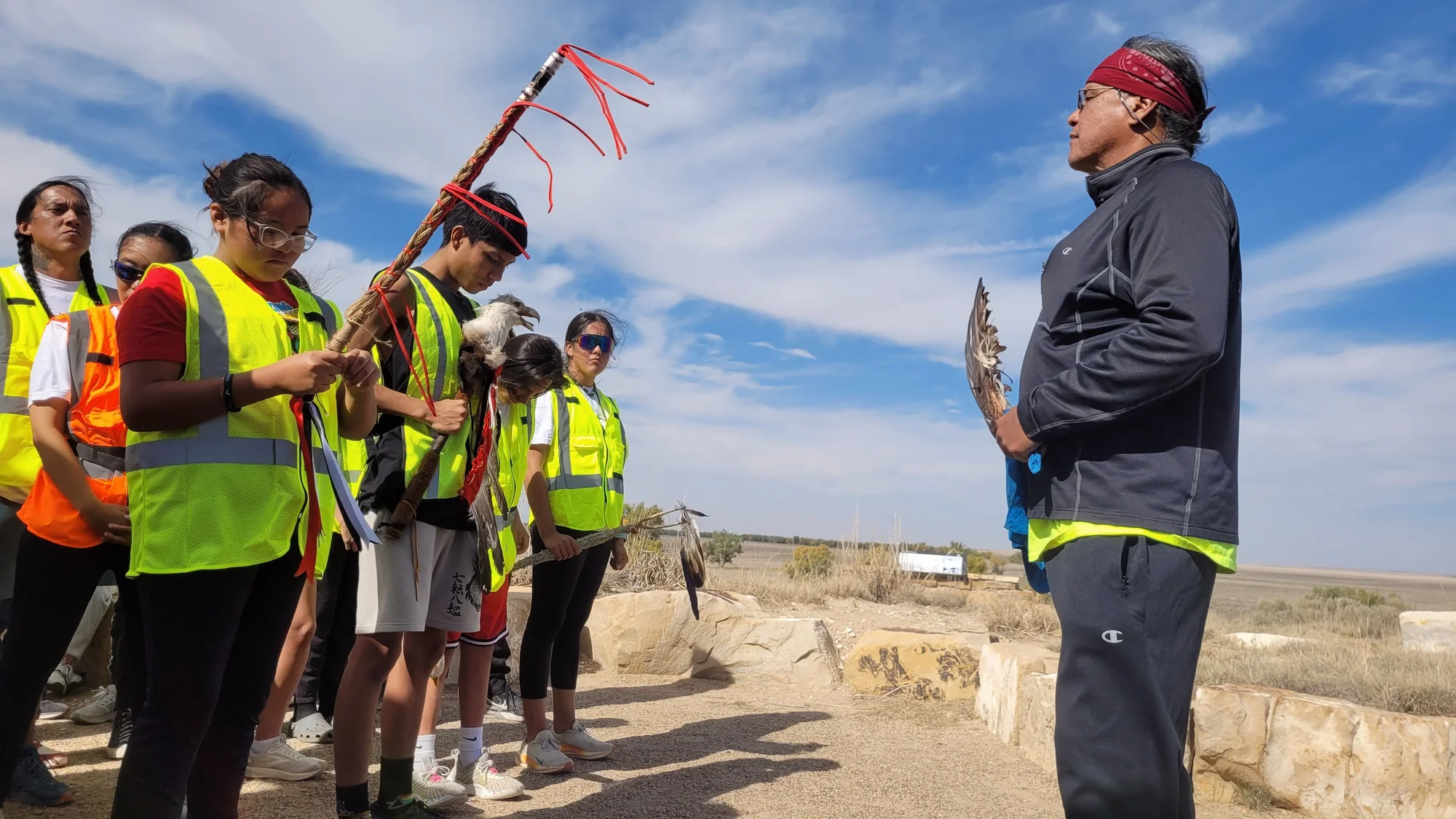 Shortly before the start of the run, Otto Braided Hair of the Northern Cheyenne Tribe speaks to a group of young runners at the Sand Creek Massacre Historical Site outside of Eads, Colo., on Oct. 17, 2024. Photo: Rae Solomon, KUNC