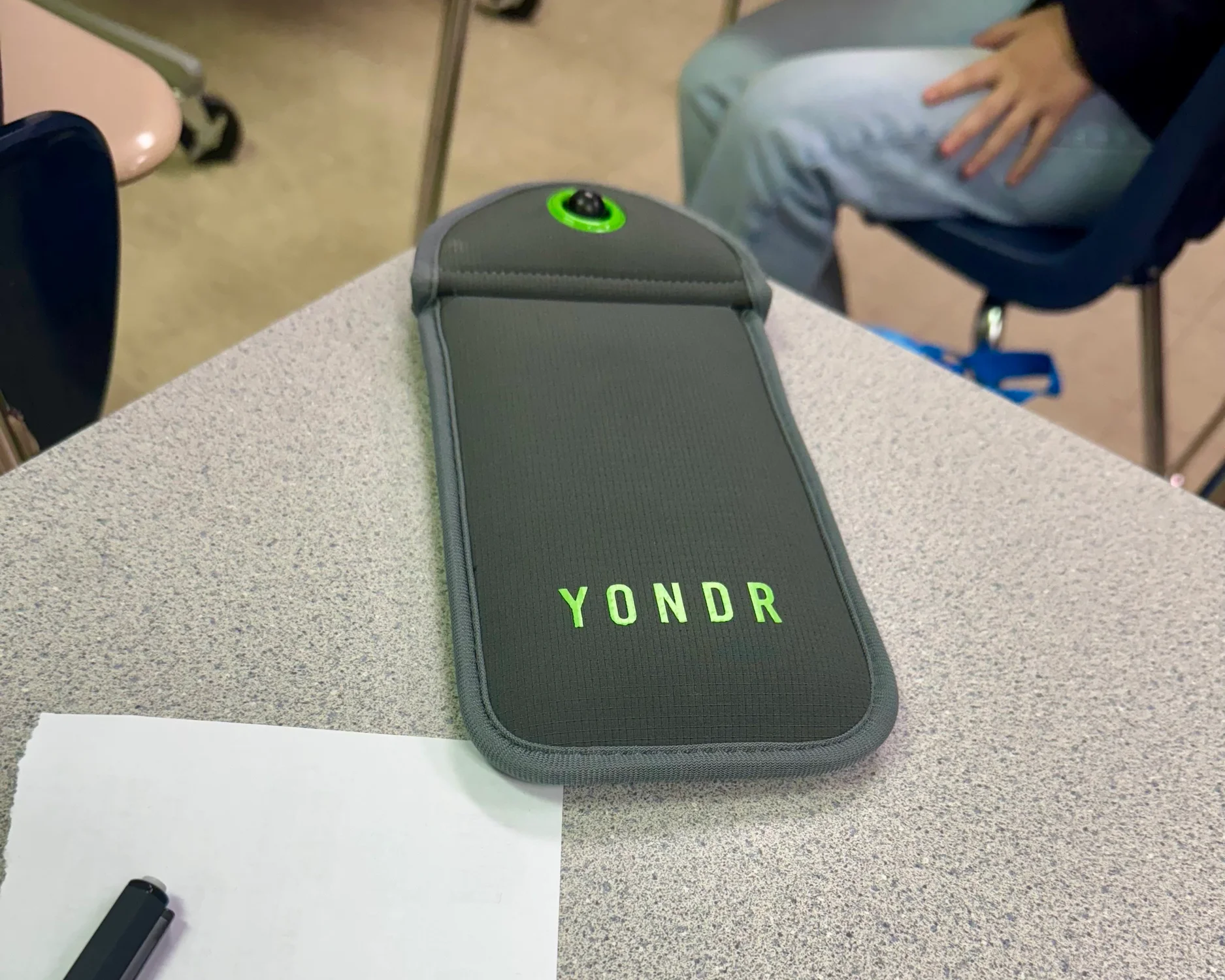 A magnetically shut Yondr pouch sits on a student's desk. The school district bought pouches for every middle and high school student, totaling more than $300,000 this year.Photo: Rachel Cohen, KUNC