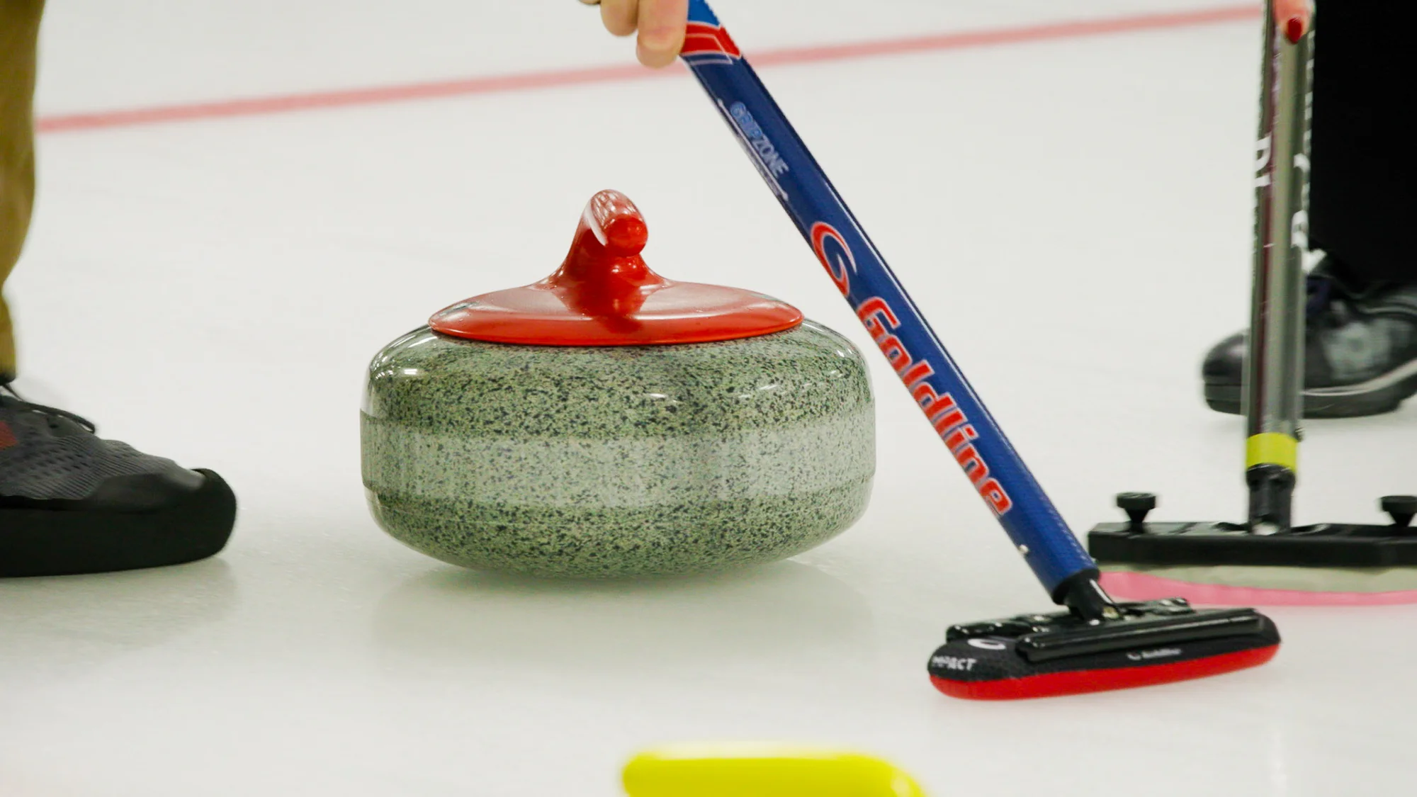Colorado is now home to two curling-specific facilities in Golden and Lafayette. Curling ice is smoother than a hockey rink. Photo: Cormac McCrimmon, Rocky Mountain PBS