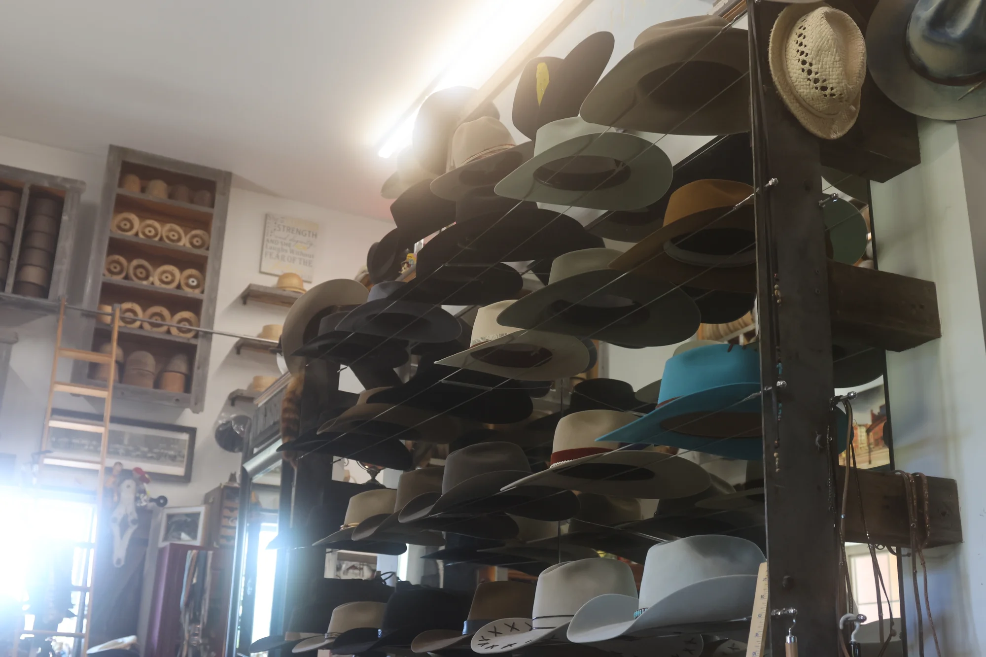 Hats made from rabbit and beaver pelt line the walls at Orr's shop in Adams County. Photo: Kyle Cooke, Rocky Mountain PBS