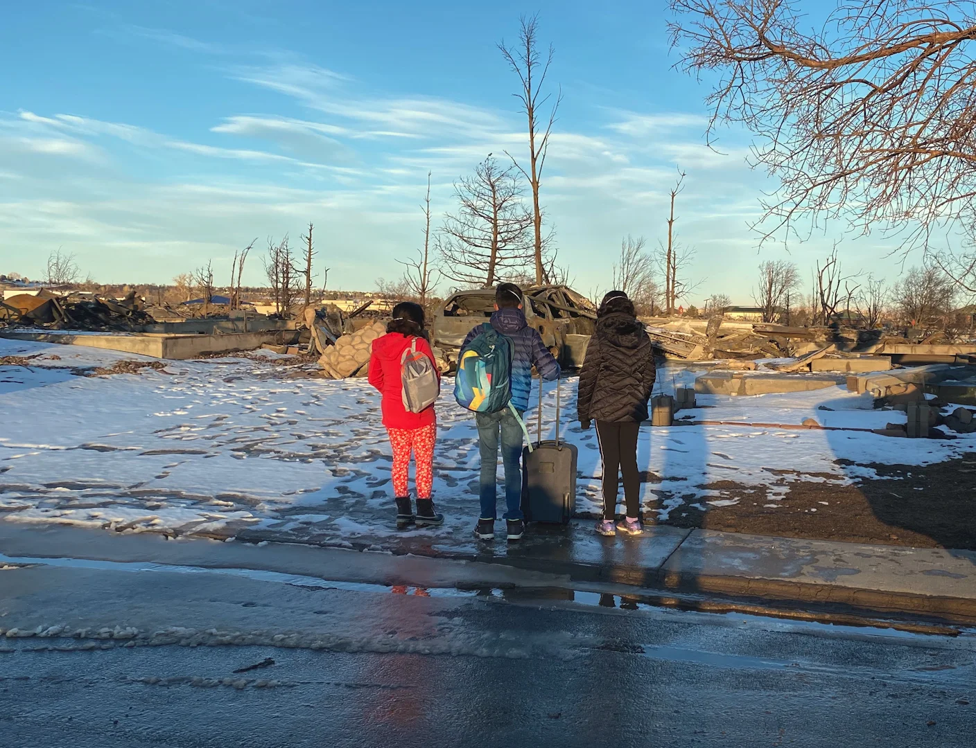 The Sobti family visit the remains of their home that was destroyed in the December 2021 Marshall Fire. Photo courtesy Manu Sobti