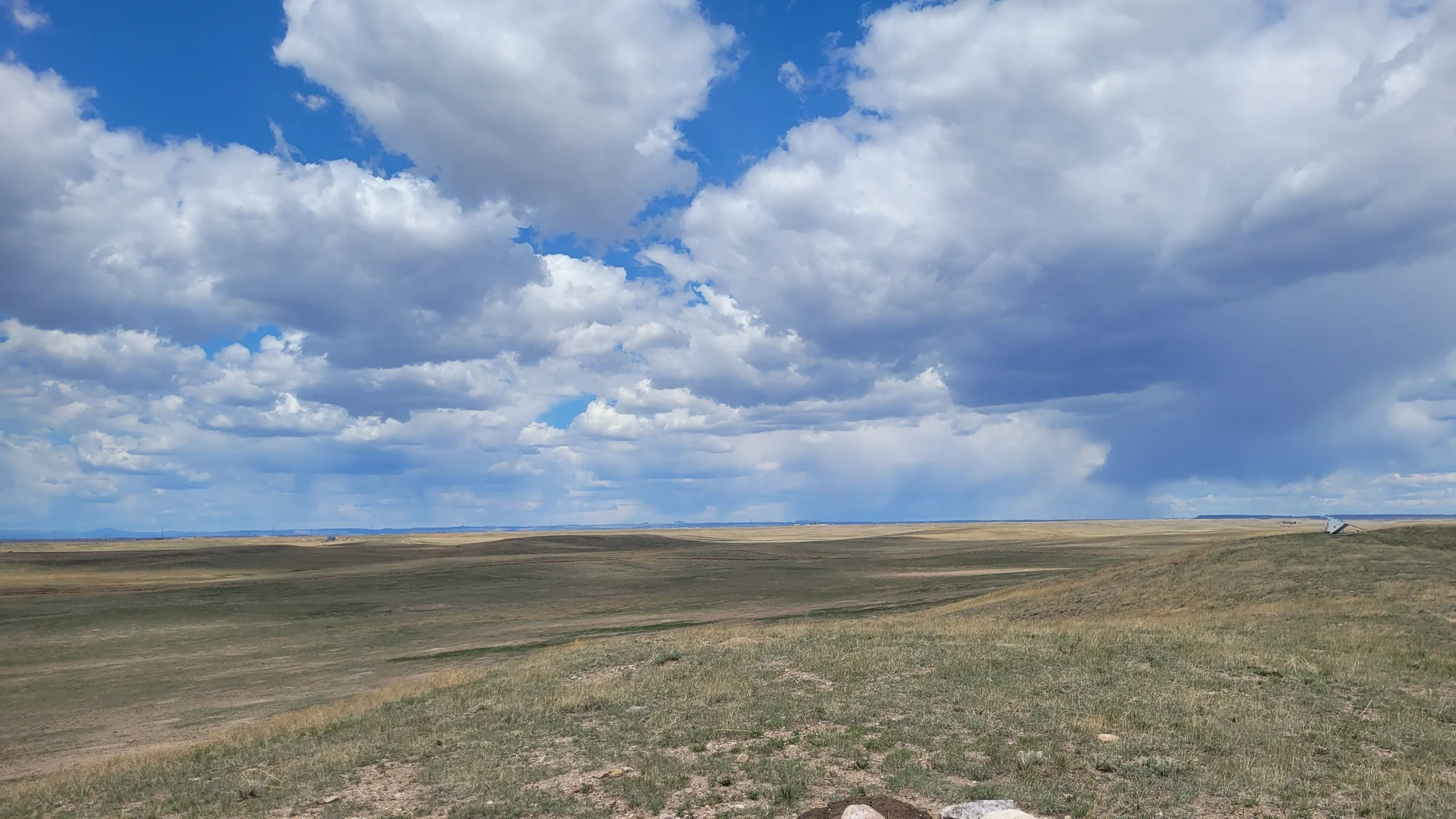 Standing at the rockpile, the untouched prairie of Pawnee National Grassland seems endless. But encroaching Front Range development is starting to threaten this fragile ecosystem where privately-owned parcels that are intermixed with the public, protected lands. Photo: Rae Solomon, KUNC