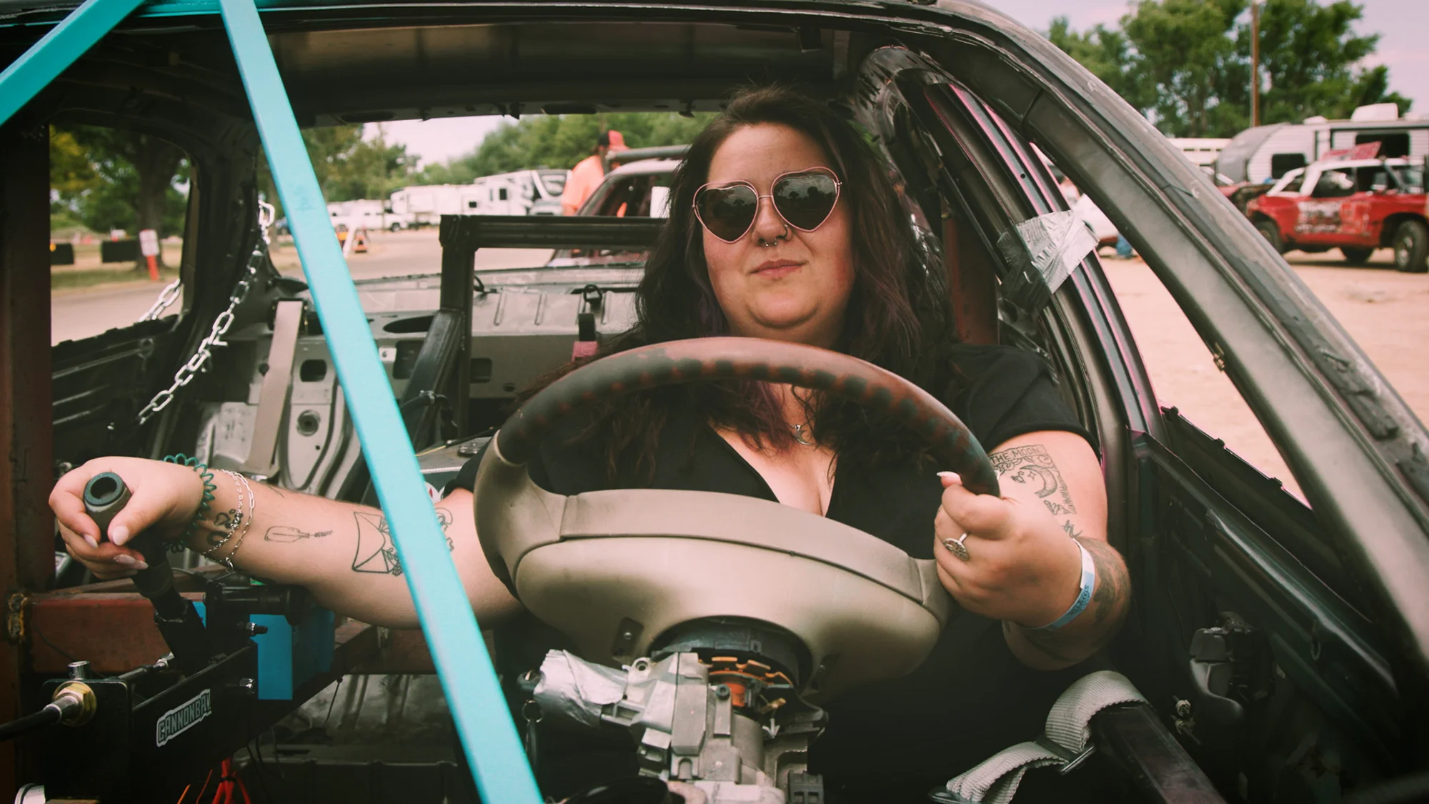 Kaylee Roberston poses in her car before her first demolition derby. Robertson had to escape through the roof of her car after it caught on fire during the show. Photo: Cormac McCrimmon, Rocky Mountain PBS