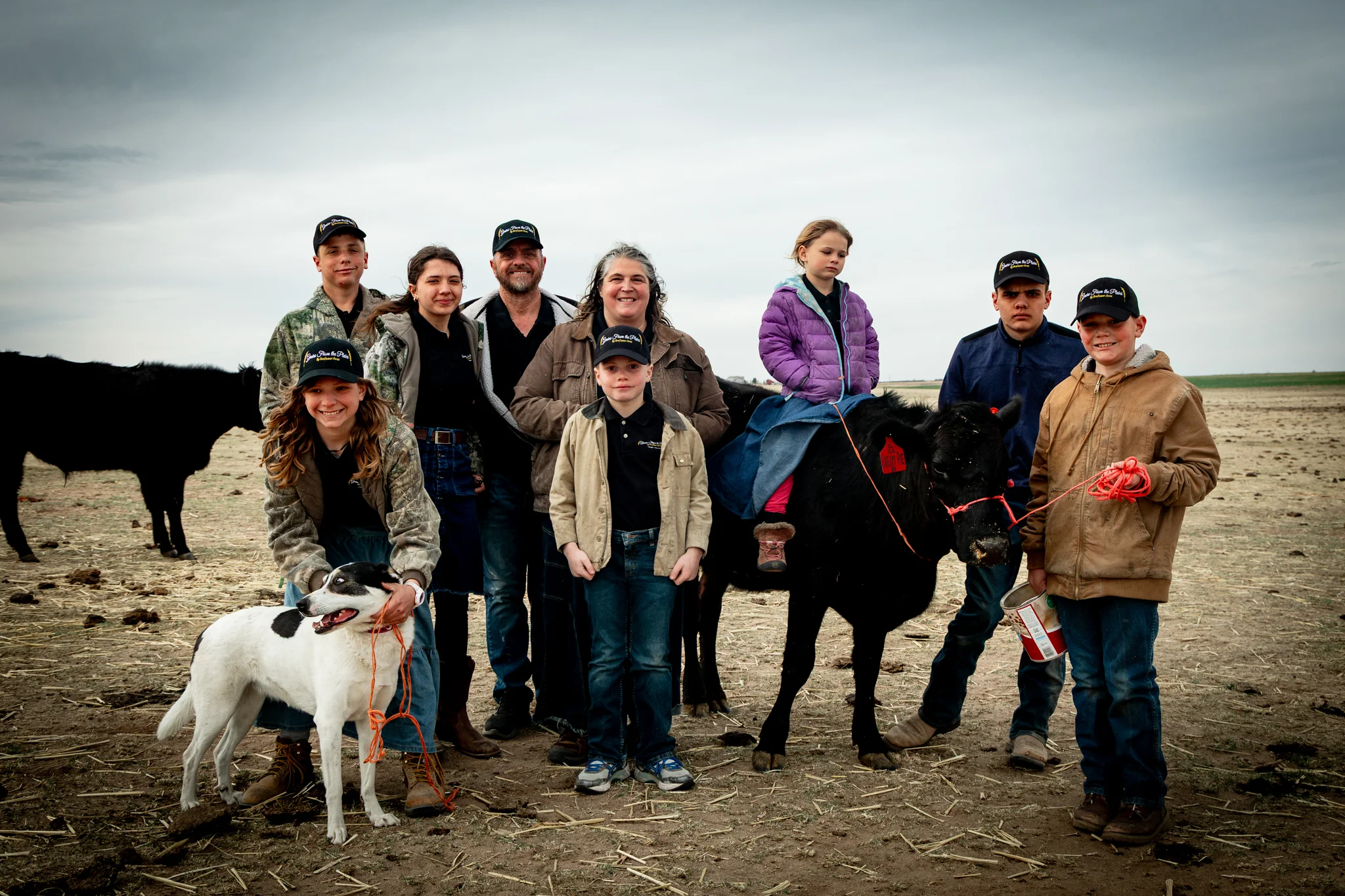 The Poss family of nine poses on their farm. Photo: Priya Shahi, Rocky Mountain PBS