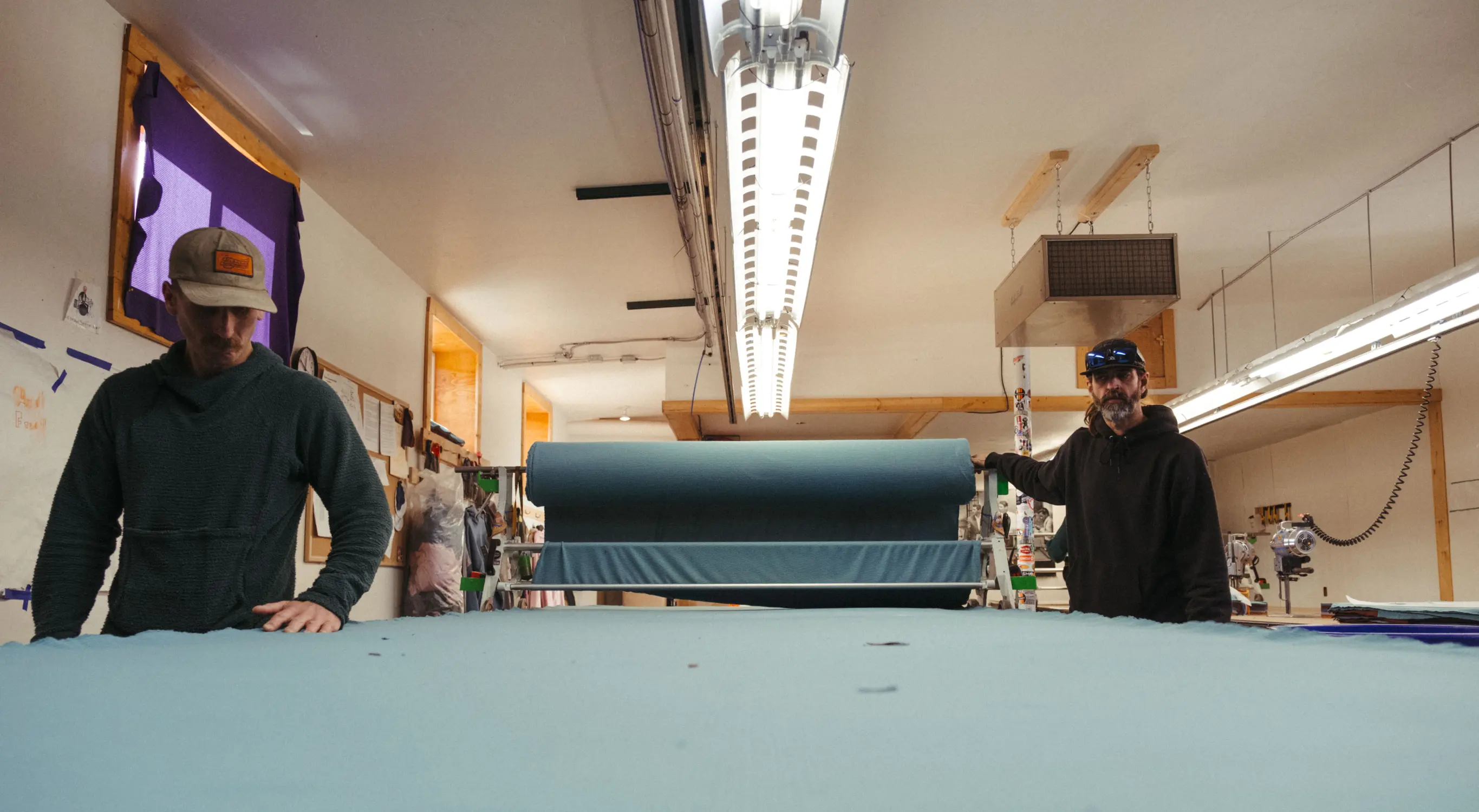 Fabric cutters work in the back of Melanzana's 7,500-square-foot headquarters. Photos: Kyle Cooke, Rocky Mountain PBS