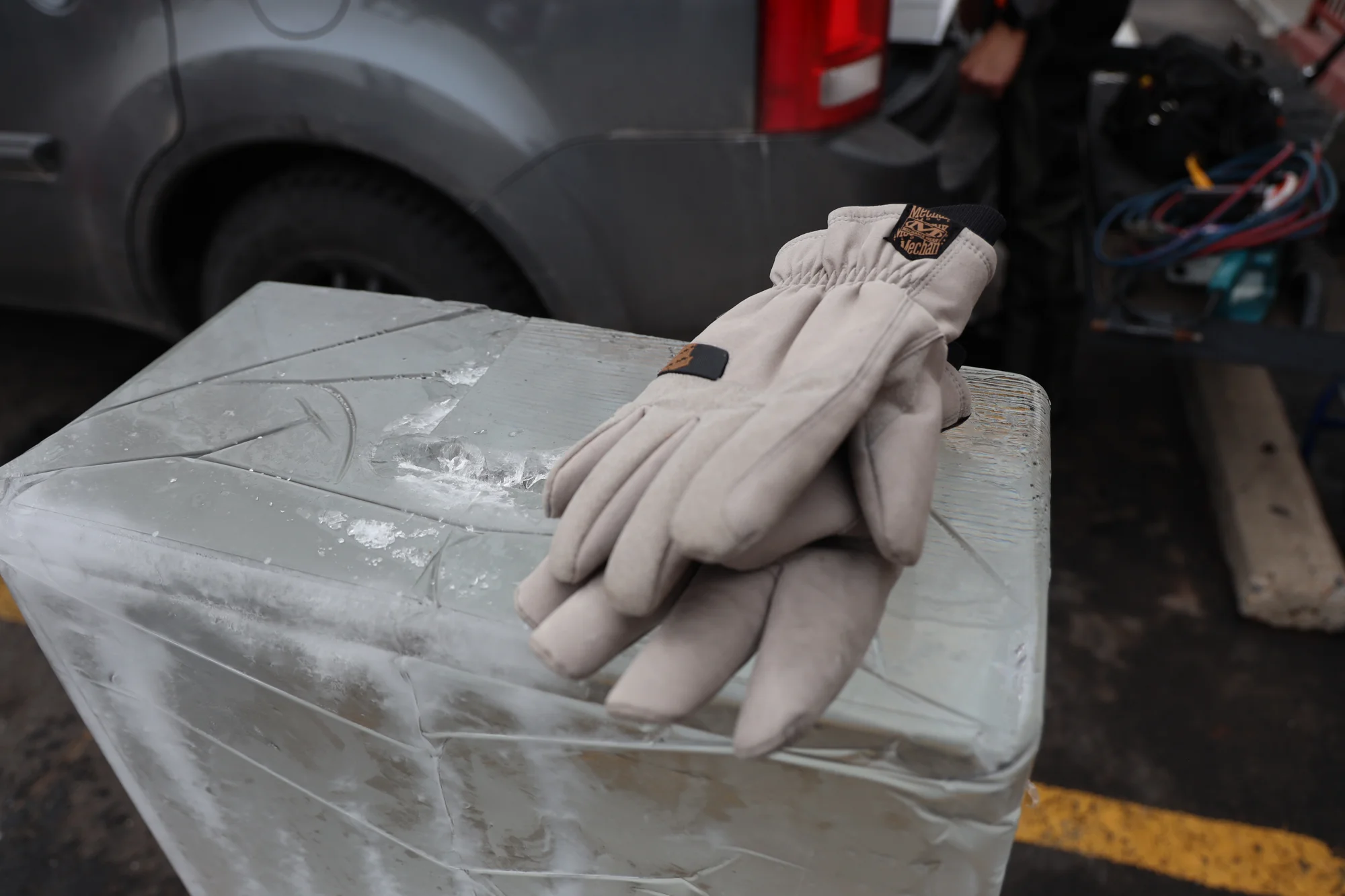 It takes Bui about an hour to unload, cut and stack two blocks of ice. Photo: Carly Rose, Rocky Mountain PBS.