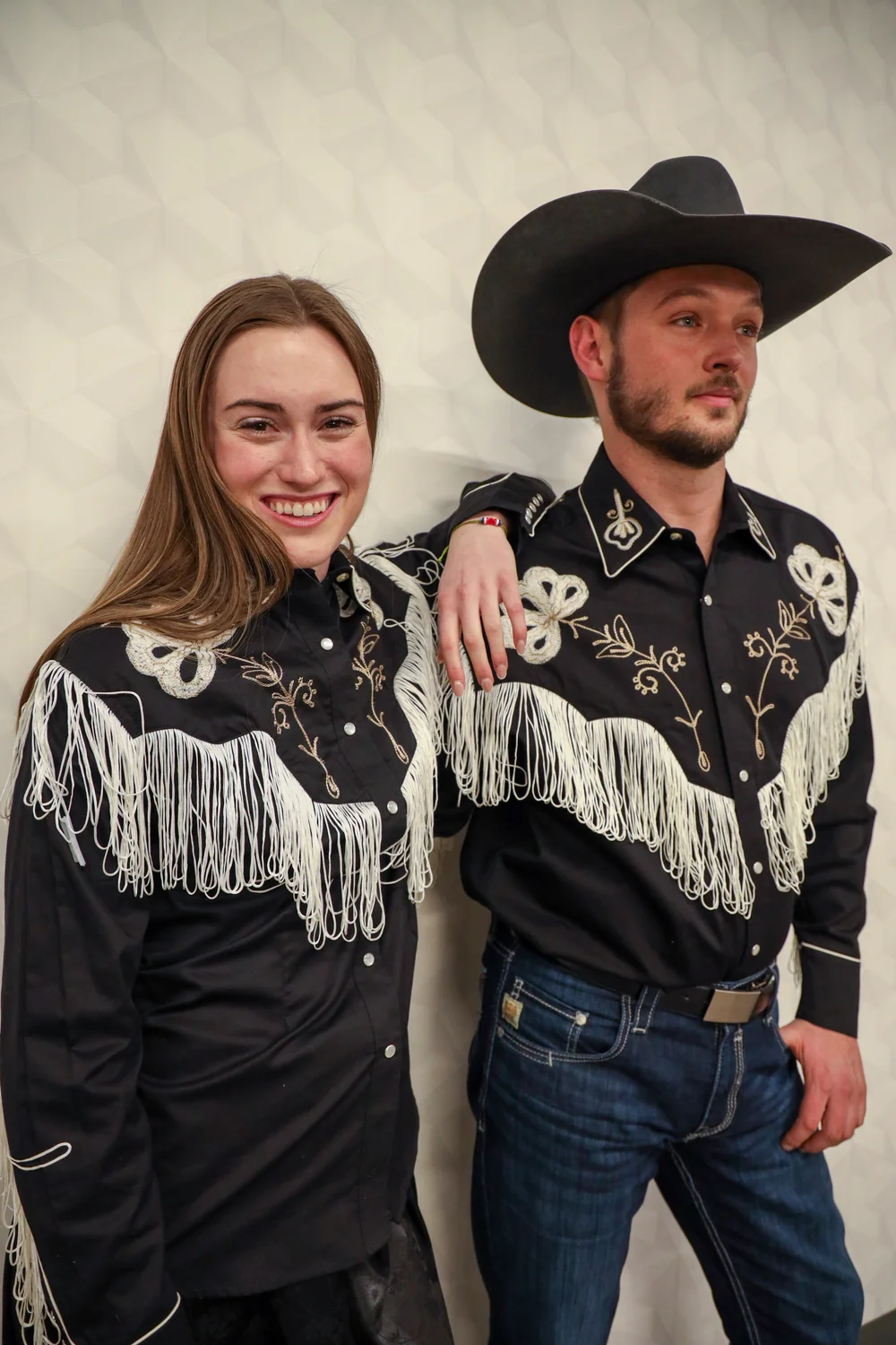 Rockmount Ranch Wear developed the pearl snap shirt, which uses snaps rather than buttons down the front of the garment. Rockmount’s founder Jack A. Weil came up with the idea after seeing bull riders rip their shirts on the bull’s horns. If something snags on a shirt with snaps, it will come unsnapped rather than tear. Some of Rockmount Ranch Wear’s shirts will be included in the fashion show.  Designed by Rockmount Ranch Wear Mfg Co. Modeled by Mackenzie Long and Justin Goss. Photo: Carly Rose, Rocky Mountain PBS