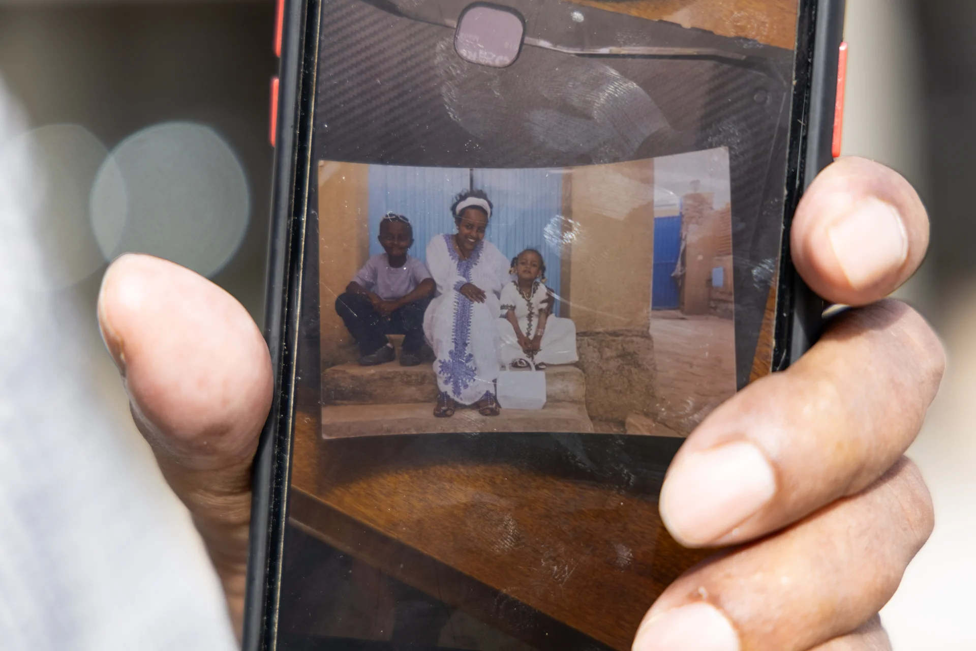 Abraha has not seen his wife (center) and two children since 2010, when his son, Mesmer was 8 and his daughter, Tmnit was 3. Photos: Andrea Kramar, Rocky Mountain PBS