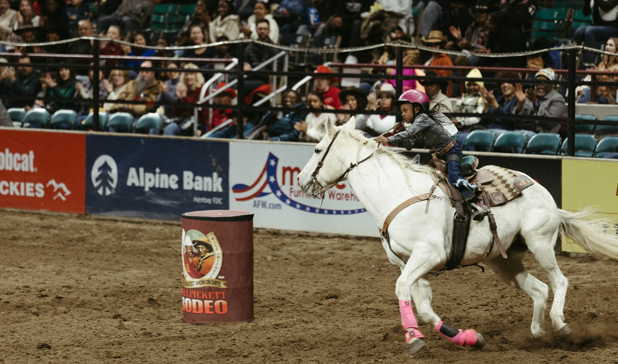 A girl rides her horse around the barrel in the barrel racing event. Photo: Peter Vo, Rocky Mountain PBS