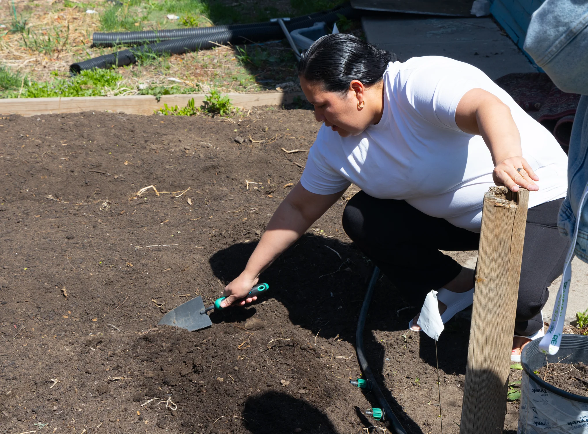 Camila Quesada loves spending time in her garden and teaching her five children how to care for it. Photo: Carly Rose, Rocky Mountain PBS