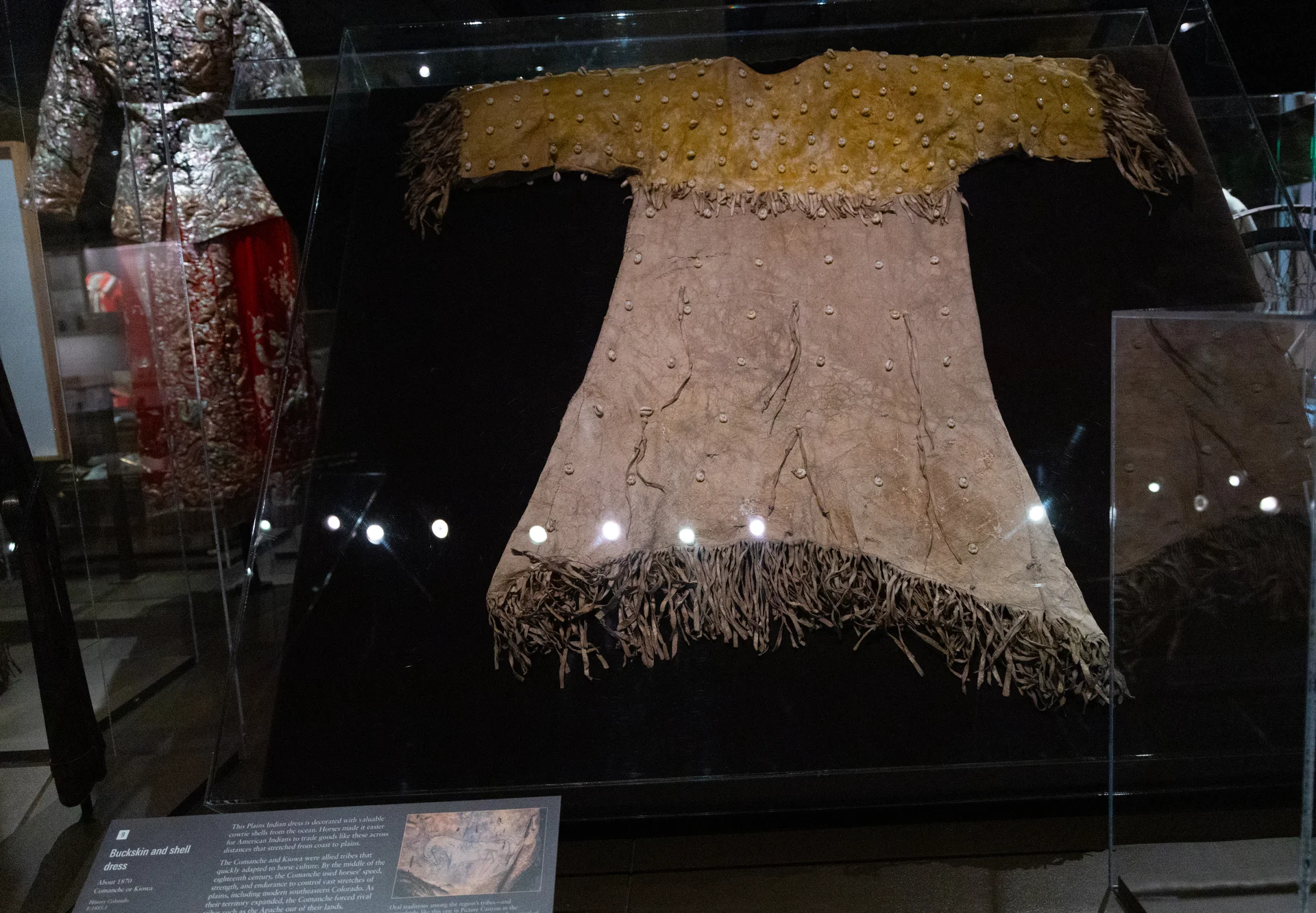 The head or tail of the animal typically hung over at the neckline of the dress. Instead of an animal part adorning the top of the dress, most feature decorative yokes. Photo: Carly Rose, Rocky Mountain PBS