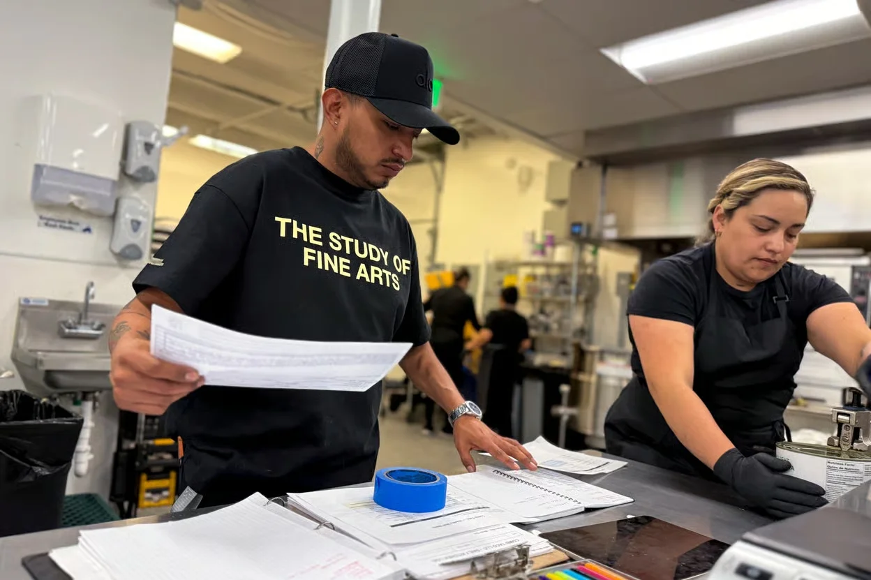 Combi Taco Catering chef Alejandro Flores-Muñoz (left) and his crew make boxed meals at a commercial kitchen in Denver's Athmar Park neighborhood. April 13, 2026. Photo: Rae Solomon, CPR News