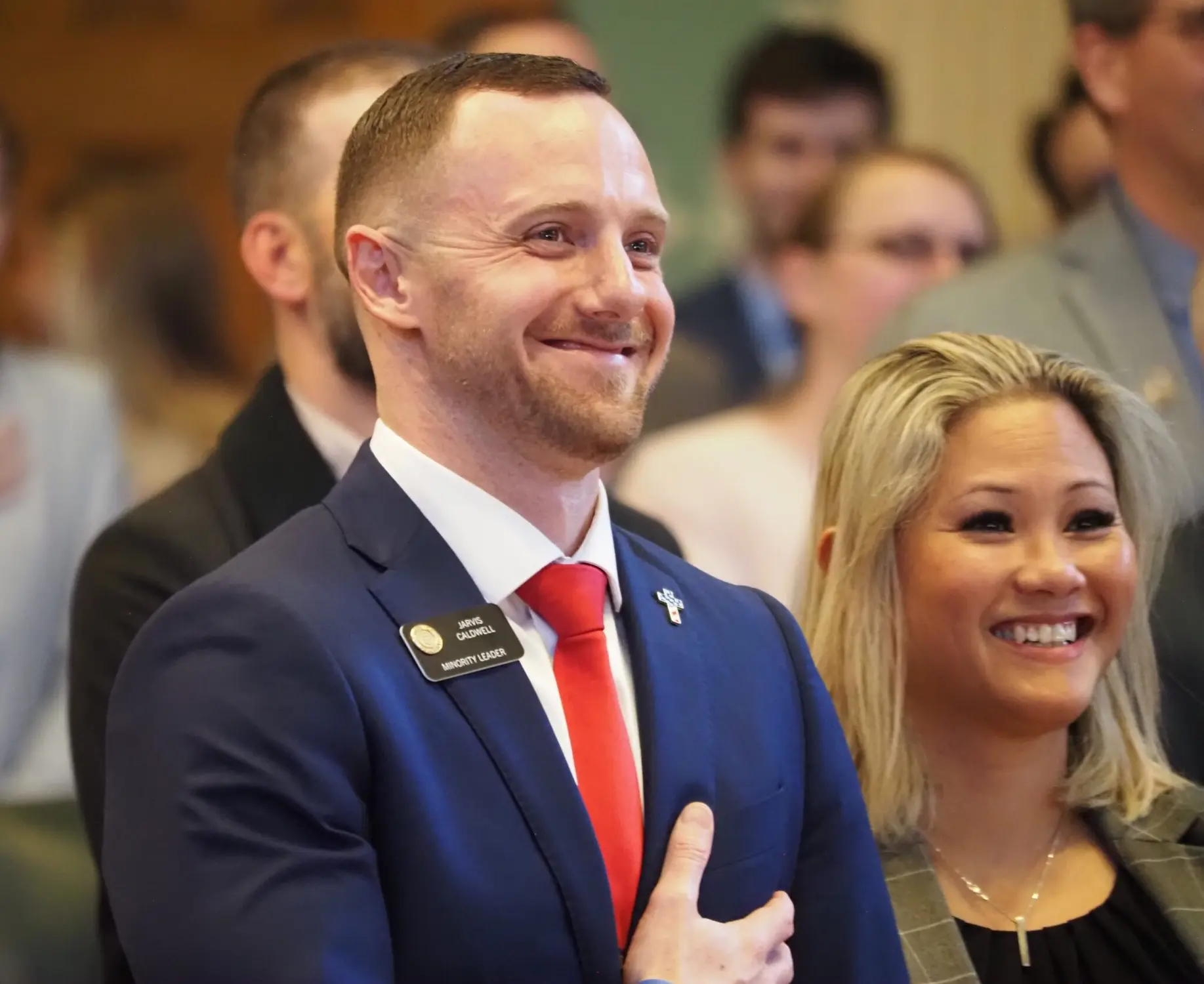 Colorado House Minority Leader Jarvis Caldwell, a Colorado Springs Republican, and his wife Anne smile as their kids help lead the Pledge of Allegiance on the opening day of the Colorado Legislature on Wednesday at the Colorado Capitol. Photo: Lindsey Toomer, Colorado Newsline