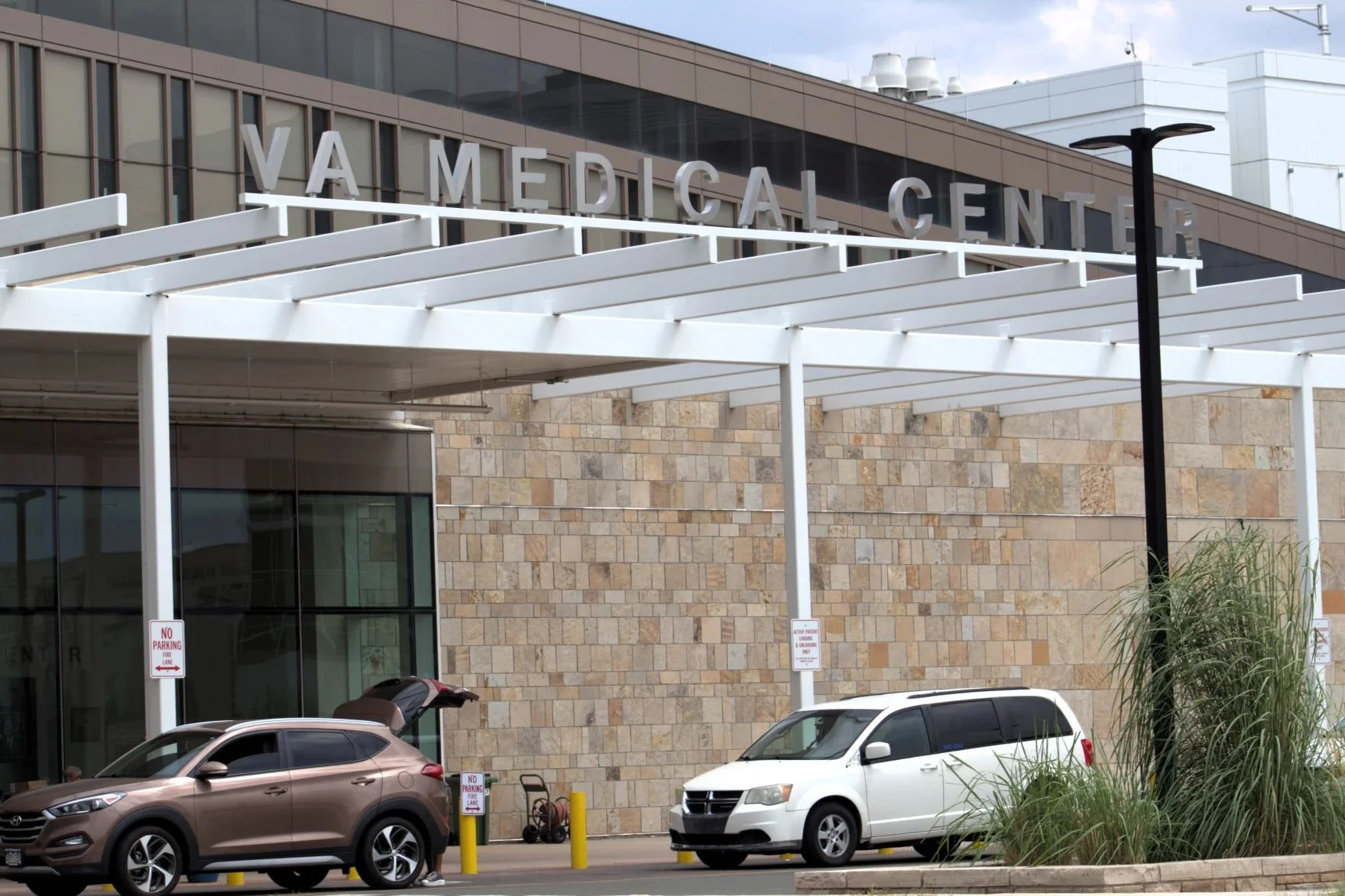 The south entrance to the Rocky Mountain Regional VA Medical Center in Aurora on July 23, 2025. It serves veterans from across Colorado and neighboring states, while more care is being provided by private doctors through the VA’s Community Care program. Photo: Kyle McKinnon, KUNC